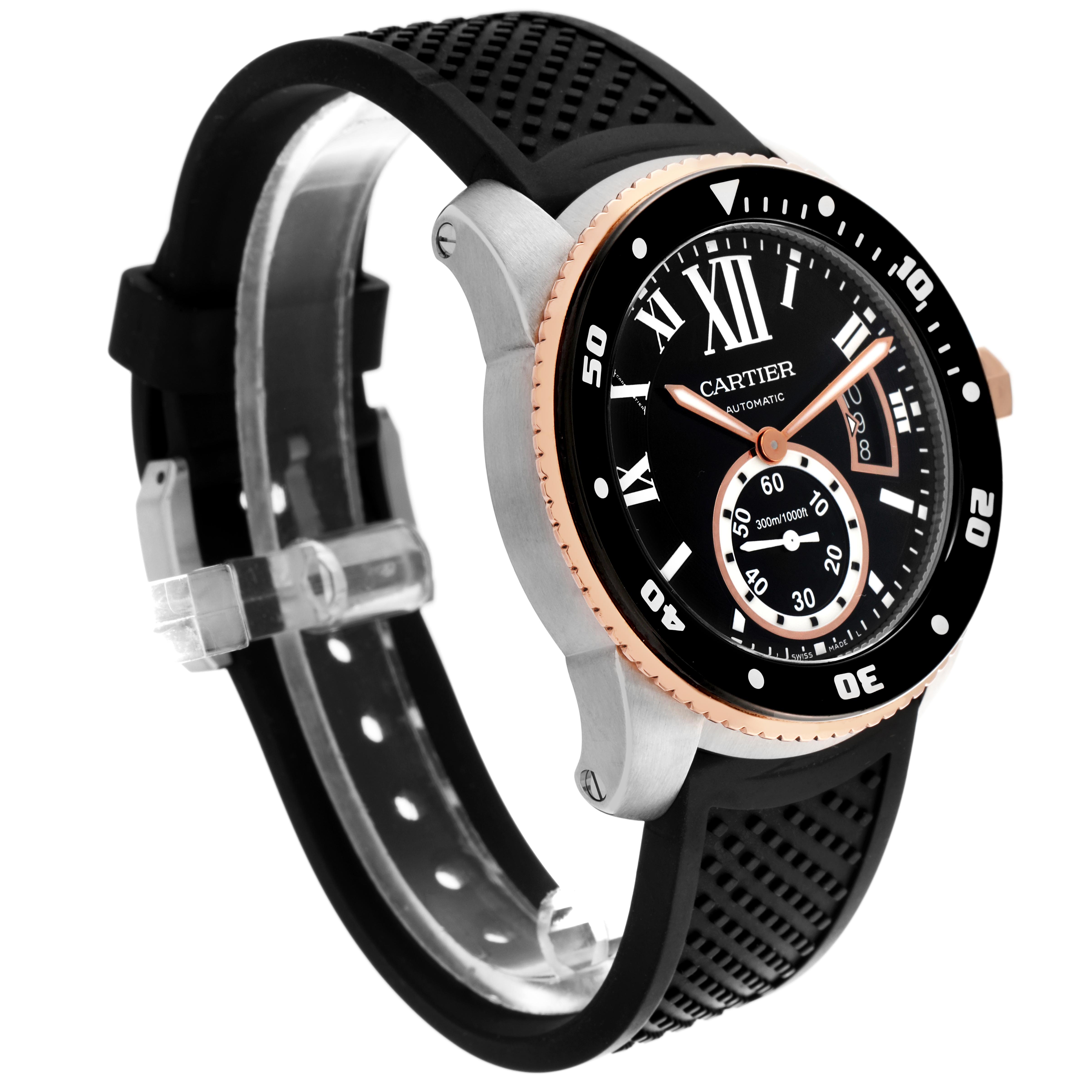The Calibre de Cartier watch is shown at a slight angle, highlighting the black dial, bezel, and rubber strap with visible side buttons.