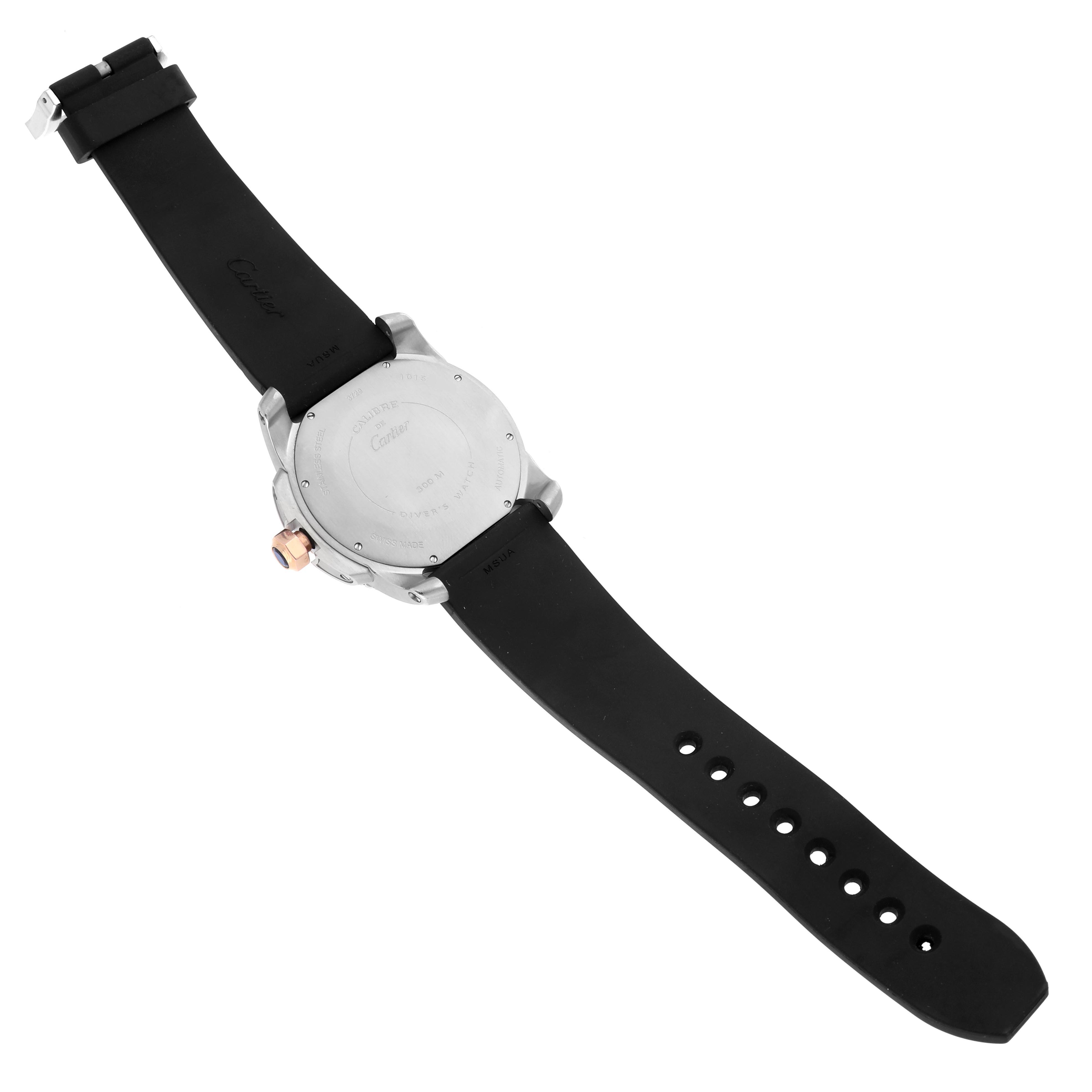 The Calibre de Cartier watch is shown from the back, displaying its case, strap, and clasp.