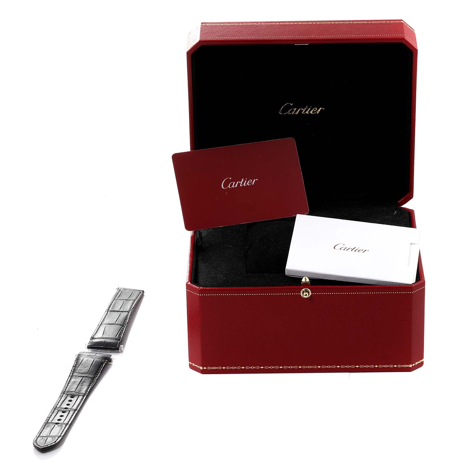 The image shows a Santos model watch by Cartier with its red box, instruction booklet, and an extra watch strap.