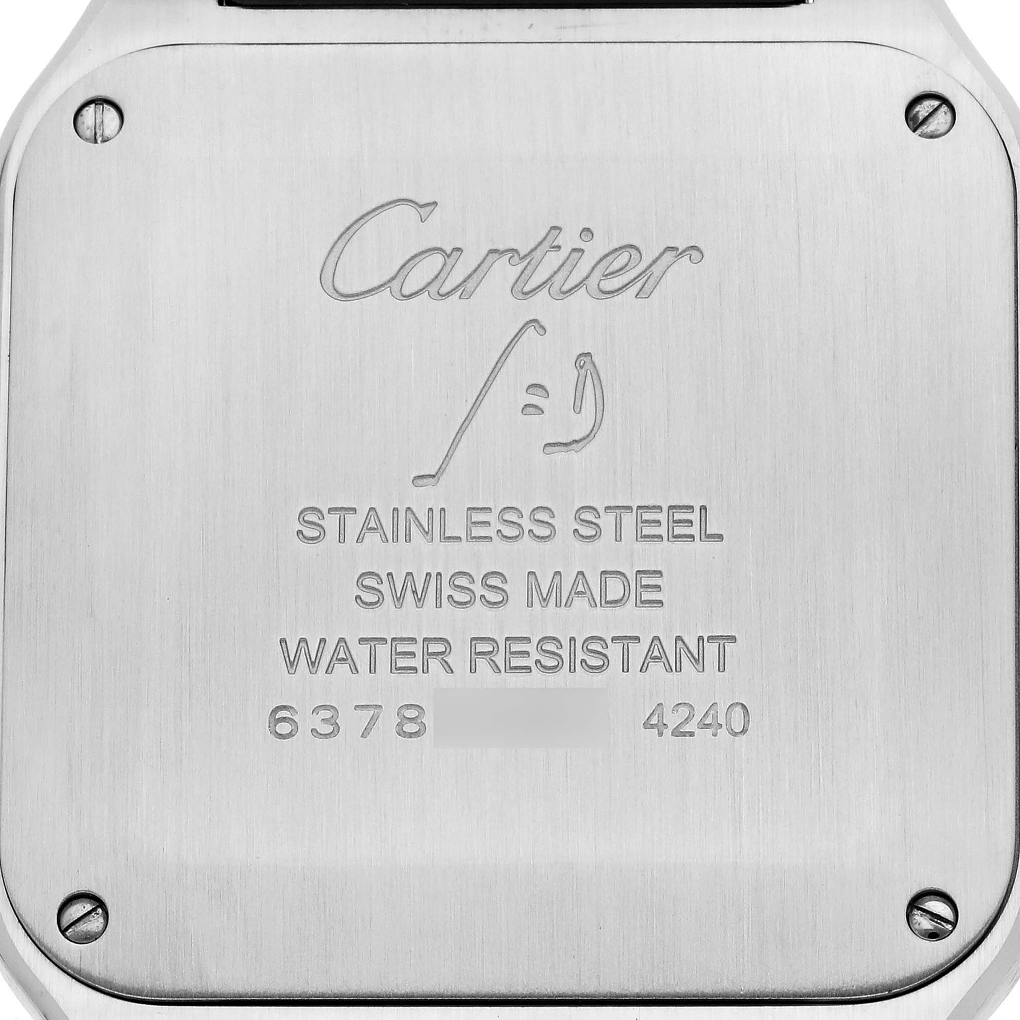 The image shows the back case of a Cartier Santos Dumont WSSA0022 Men's Stainless Steel Silver Dial WSSA0022 Men's Stainless Steel Silver Dial watch, engraved with details about the model and material.