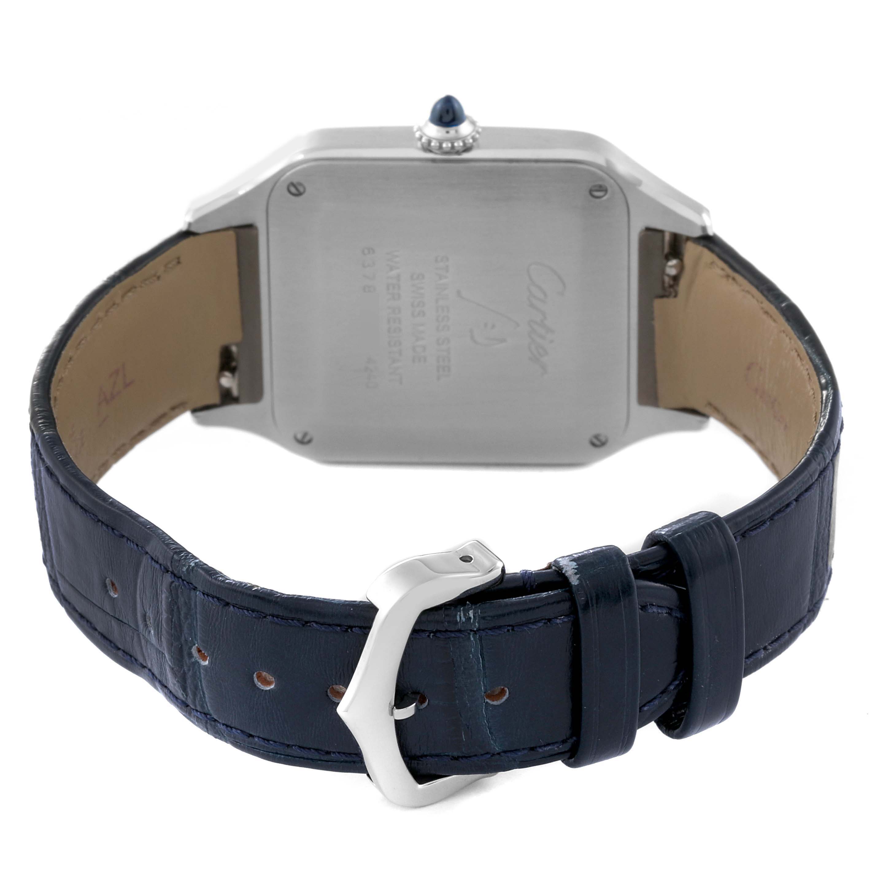 The image shows the back view of the Cartier Santos Dumont WSSA0022 Men's Stainless Steel Silver Dial WSSA0022 Men's Stainless Steel Silver Dial watch, highlighting the case back and its blue leather strap with buckle.