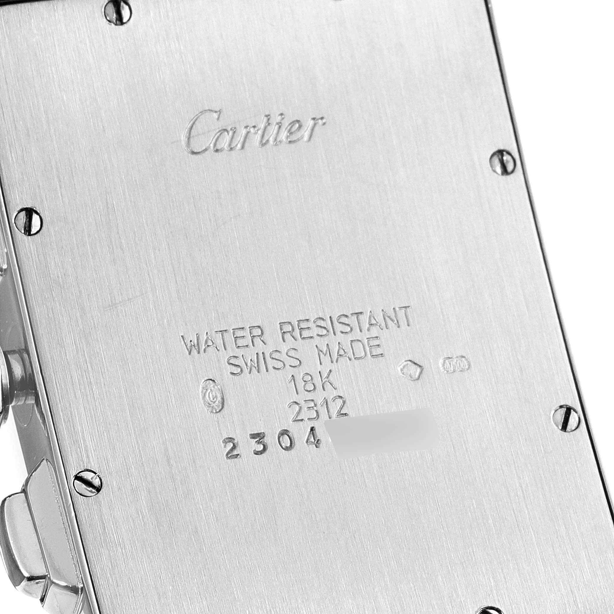 The image shows the back case of a Tank Americaine model by Cartier, highlighting its inscriptions and screws.