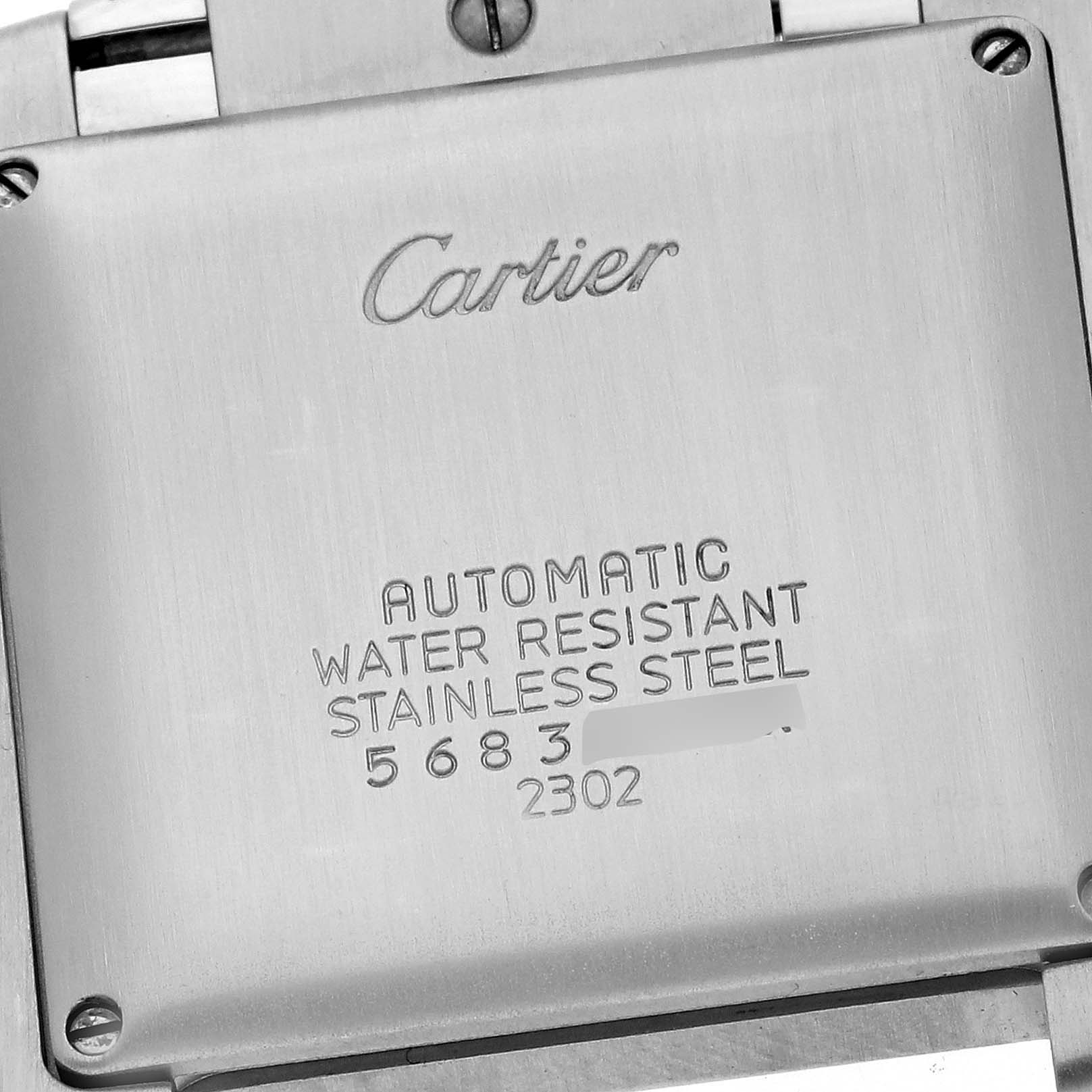 The image shows the case back of a Cartier Tank Francaise W51002Q3 Men
s Stainless Steel Silver Dial W51002Q3 Men
s Stainless Steel Silver Dial watch, highlighting its engravings and stainless steel composition.