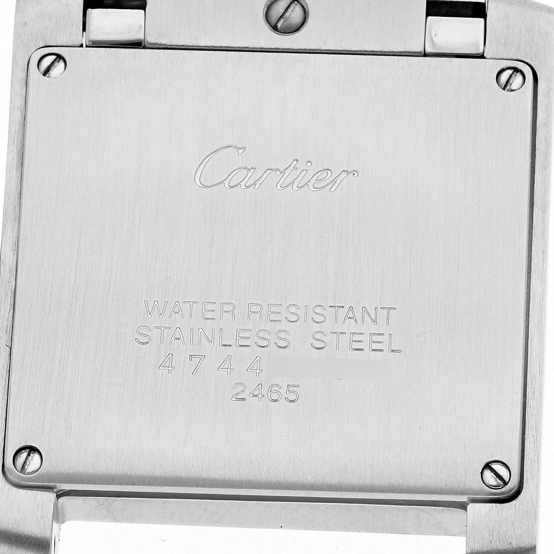 The image shows the back case of a Cartier Tank Française watch, highlighting its engravings and screws.