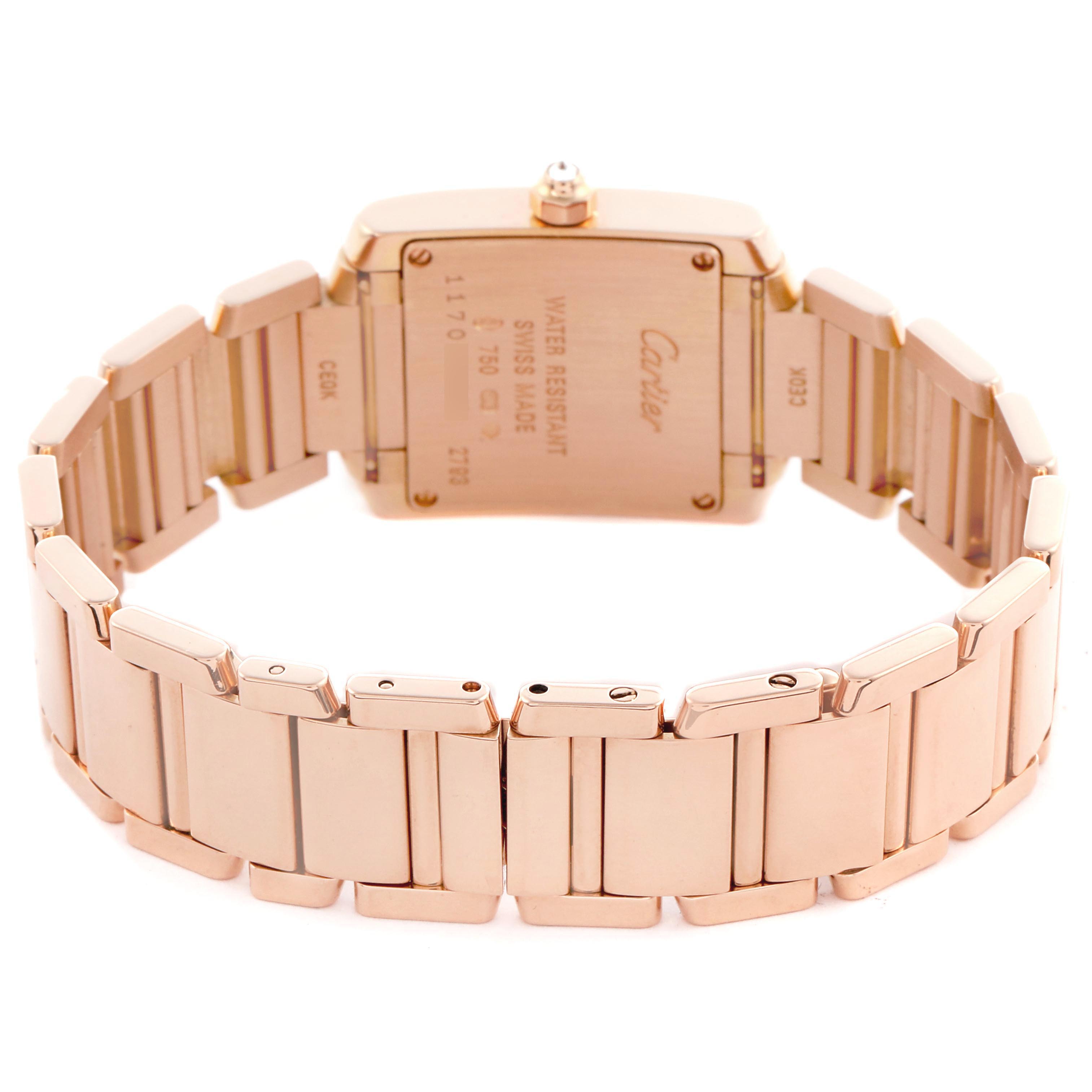 The Cartier Tank Française watch is shown from the back, displaying its case back and linked bracelet.