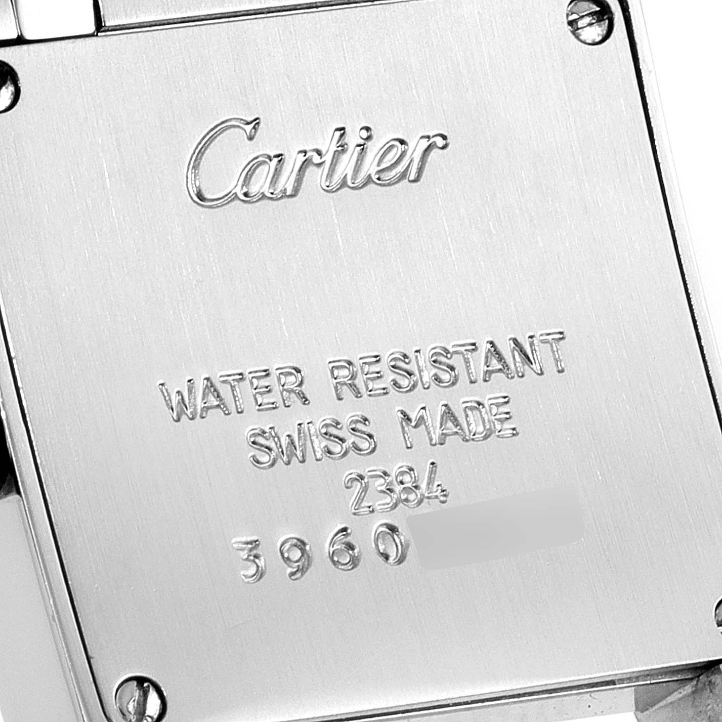 This image shows the case back of a Cartier Tank Francaise W51007Q4 Women's Steel and Gold (two tone) Silver Dial W51007Q4 Women's Steel and Gold (two tone) Silver Dial watch, featuring engraved branding and specifications.