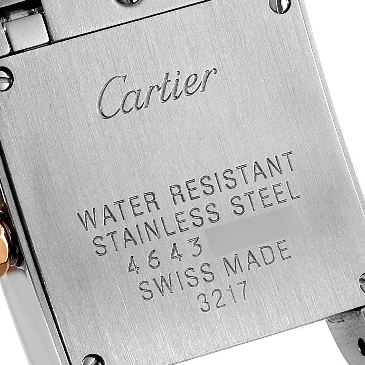 This is a close-up of the back of a Cartier Tank Francaise W5010001 Women's Steel and Gold (two tone) Black Dial W5010001 Women's Steel and Gold (two tone) Black Dial watch, showing details like brand engraving and specifications.