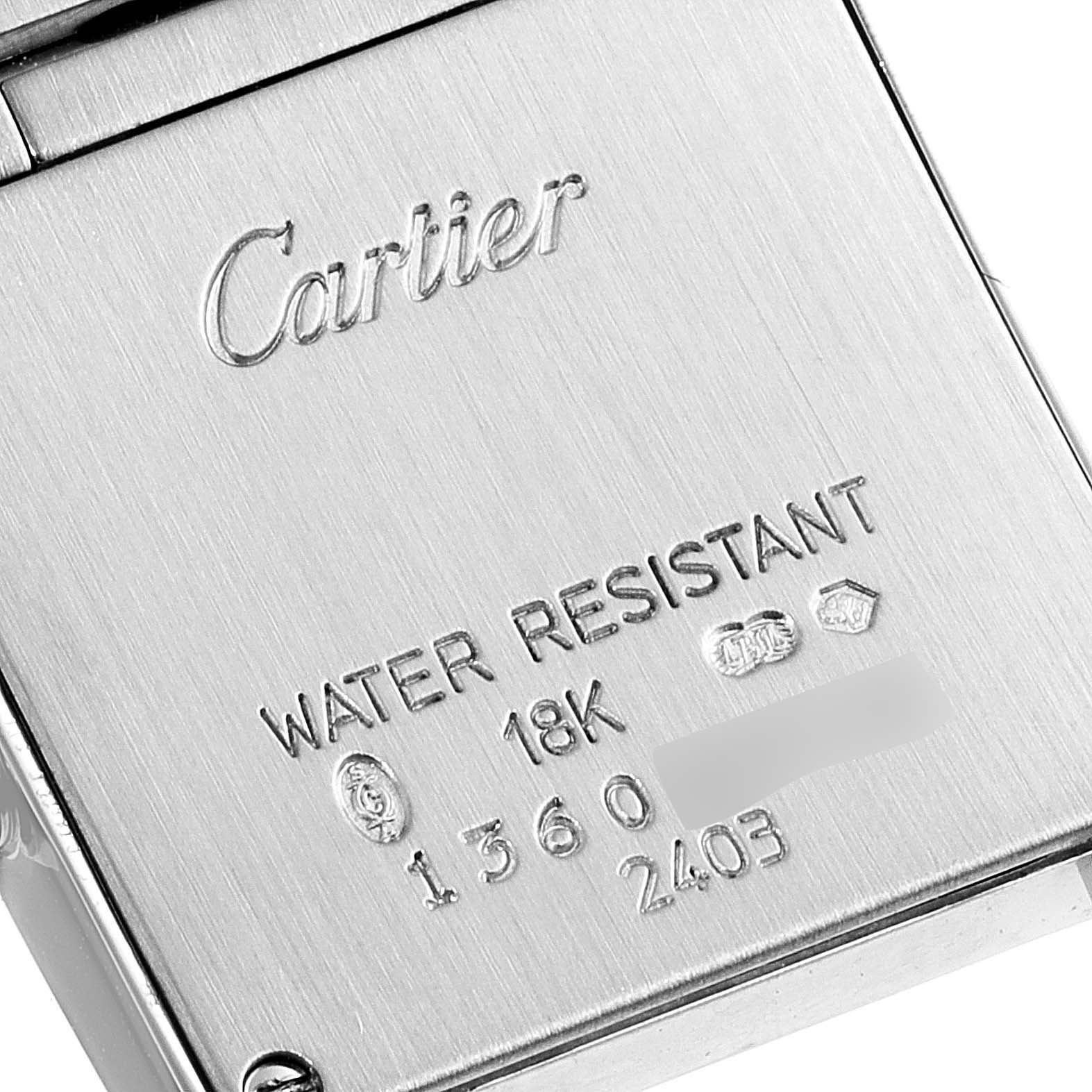 This image shows the back of a Cartier Tank Francaise W50012S3 Women's White Gold Silver Dial W50012S3 Women's White Gold Silver Dial watch, engraved with the brand name and specifications.