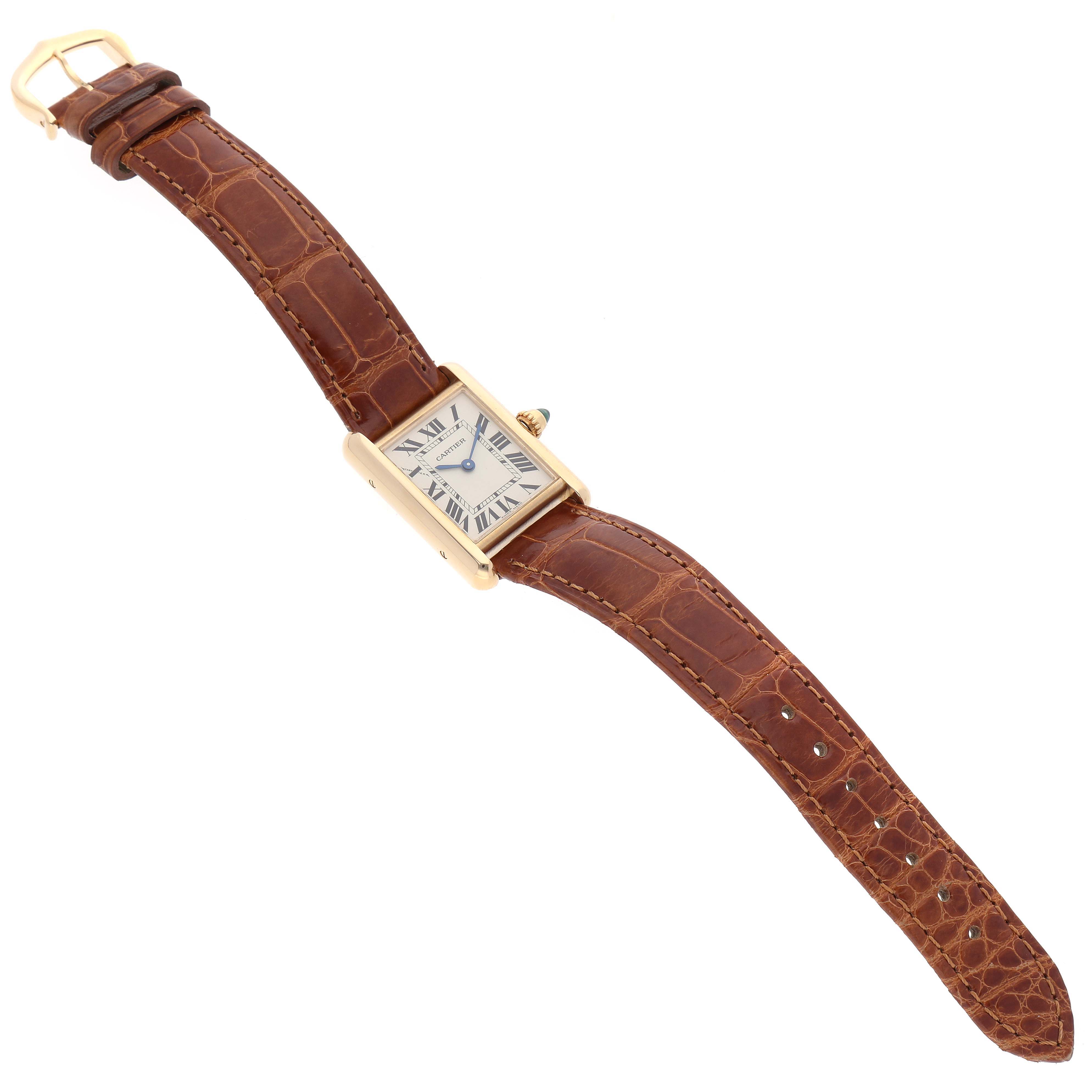 The image shows a Cartier Tank Louis W1529856 Women's Yellow Gold Silver Dial W1529856 Women's Yellow Gold Silver Dial model watch, angled slightly above, displaying the face, case, and brown leather strap.