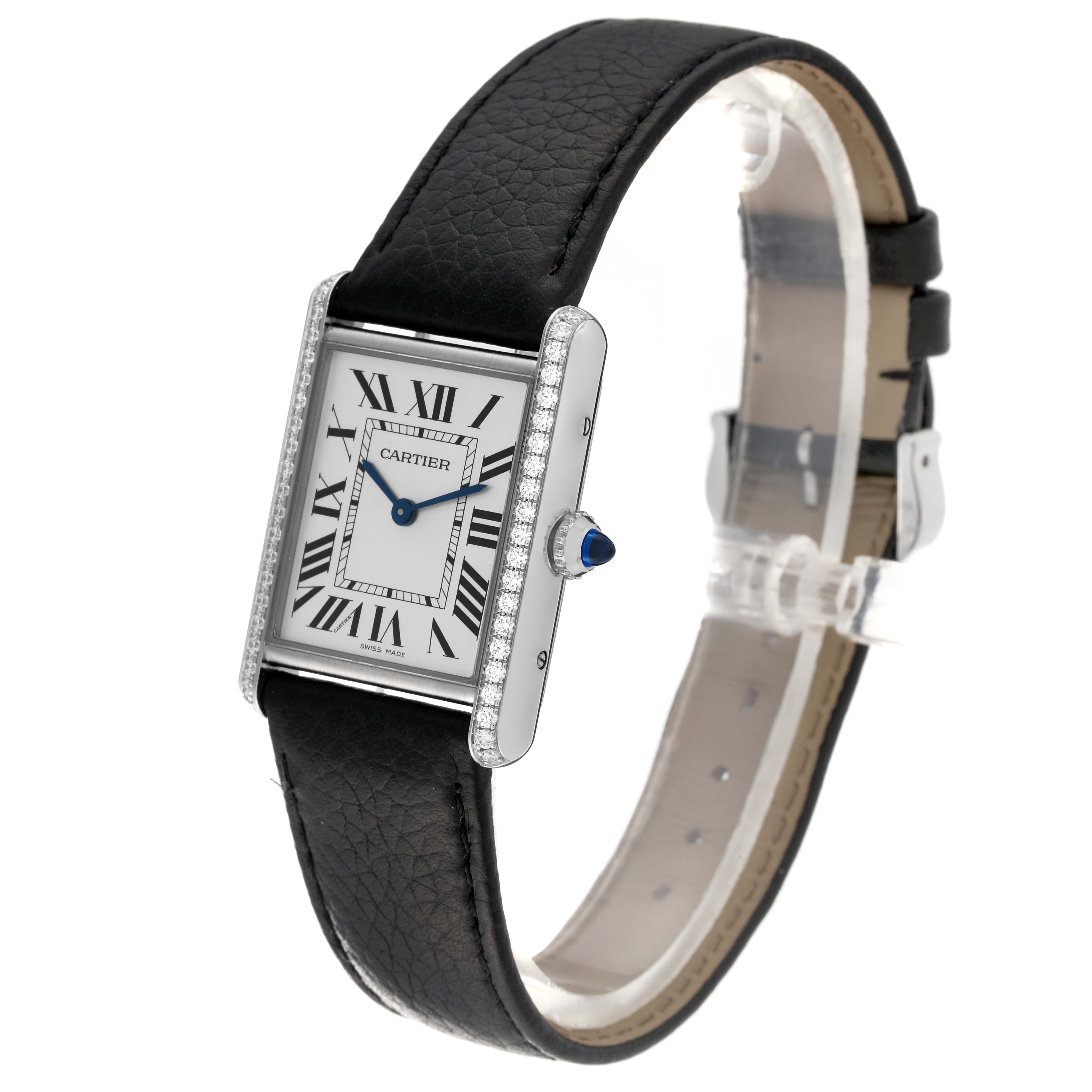 The image shows a side and front angle of the Cartier Tank Must W4TA0017 Women
s Stainless Steel Silver Dial W4TA0017 Women
s Stainless Steel Silver Dial watch, featuring its leather strap and rectangular face with Roman numerals.