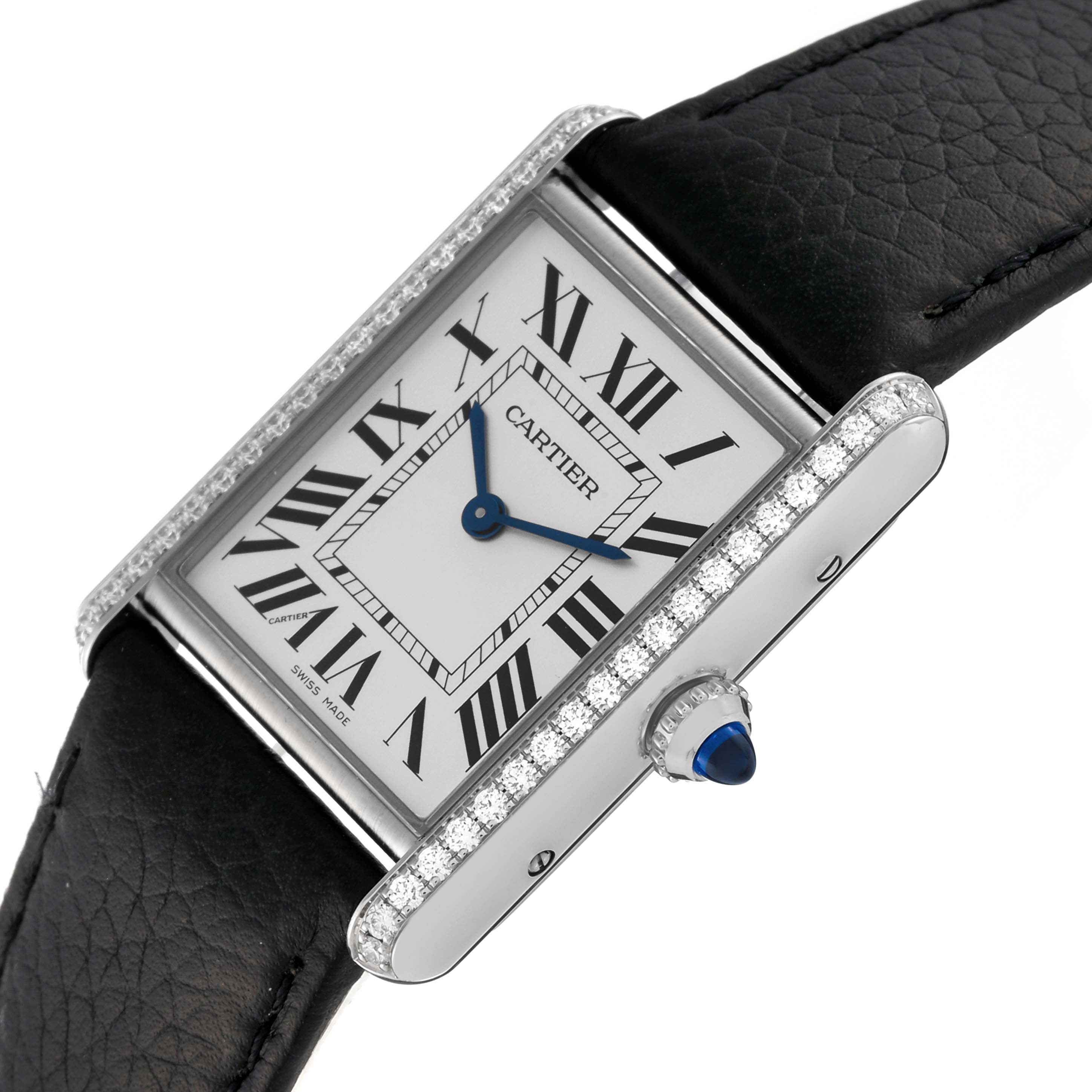 The Cartier Tank Must W4TA0017 Women
s Stainless Steel Silver Dial W4TA0017 Women
s Stainless Steel Silver Dial watch is shown at an oblique angle, highlighting its rectangular face, Roman numerals, diamond bezel, and crown with a blue cabochon.