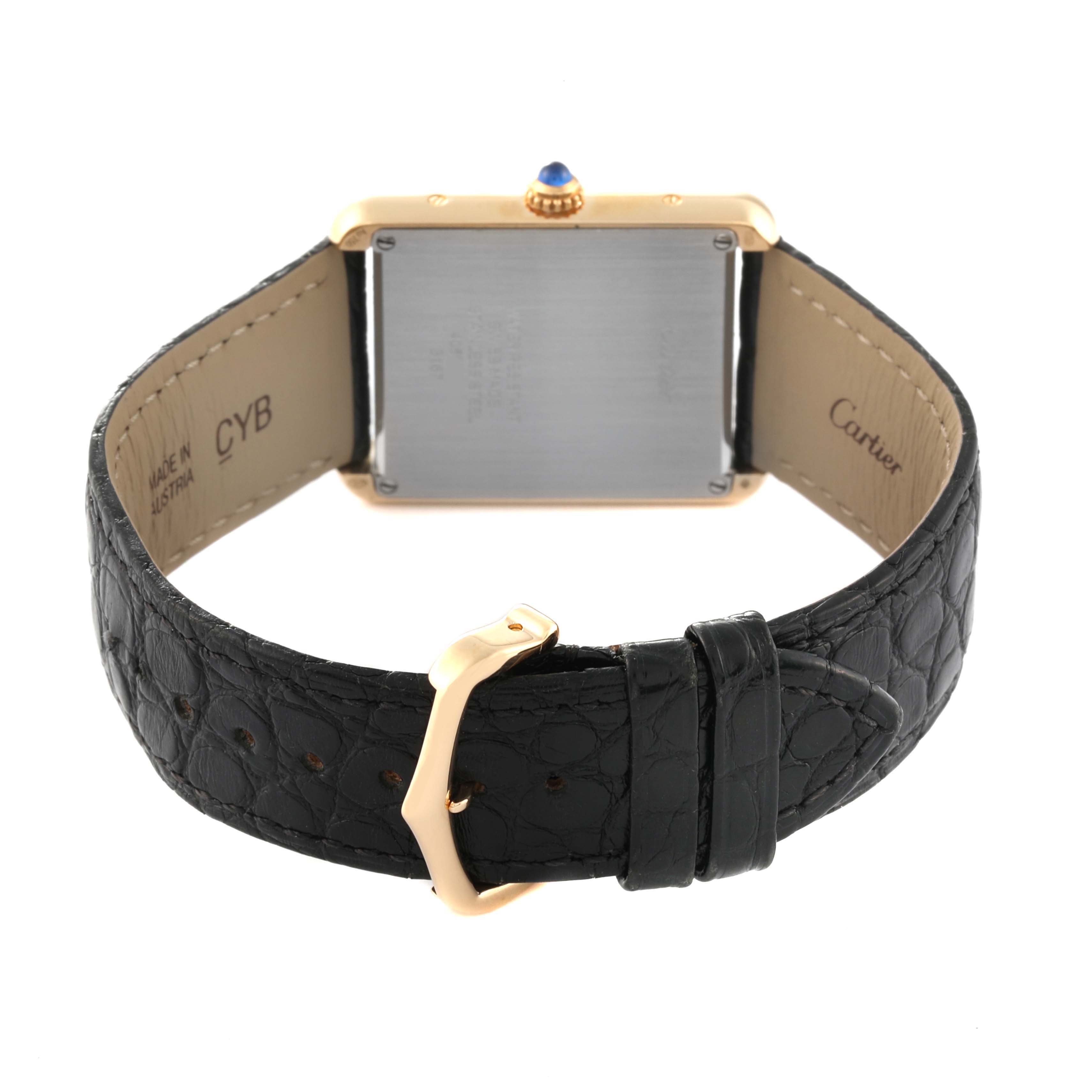 The image shows the back view of a Cartier Tank Solo W5200004 Men
s Steel and Gold (two tone) Silver Dial W5200004 Men
s Steel and Gold (two tone) Silver Dial watch, highlighting its caseback, black leather strap, and buckle.