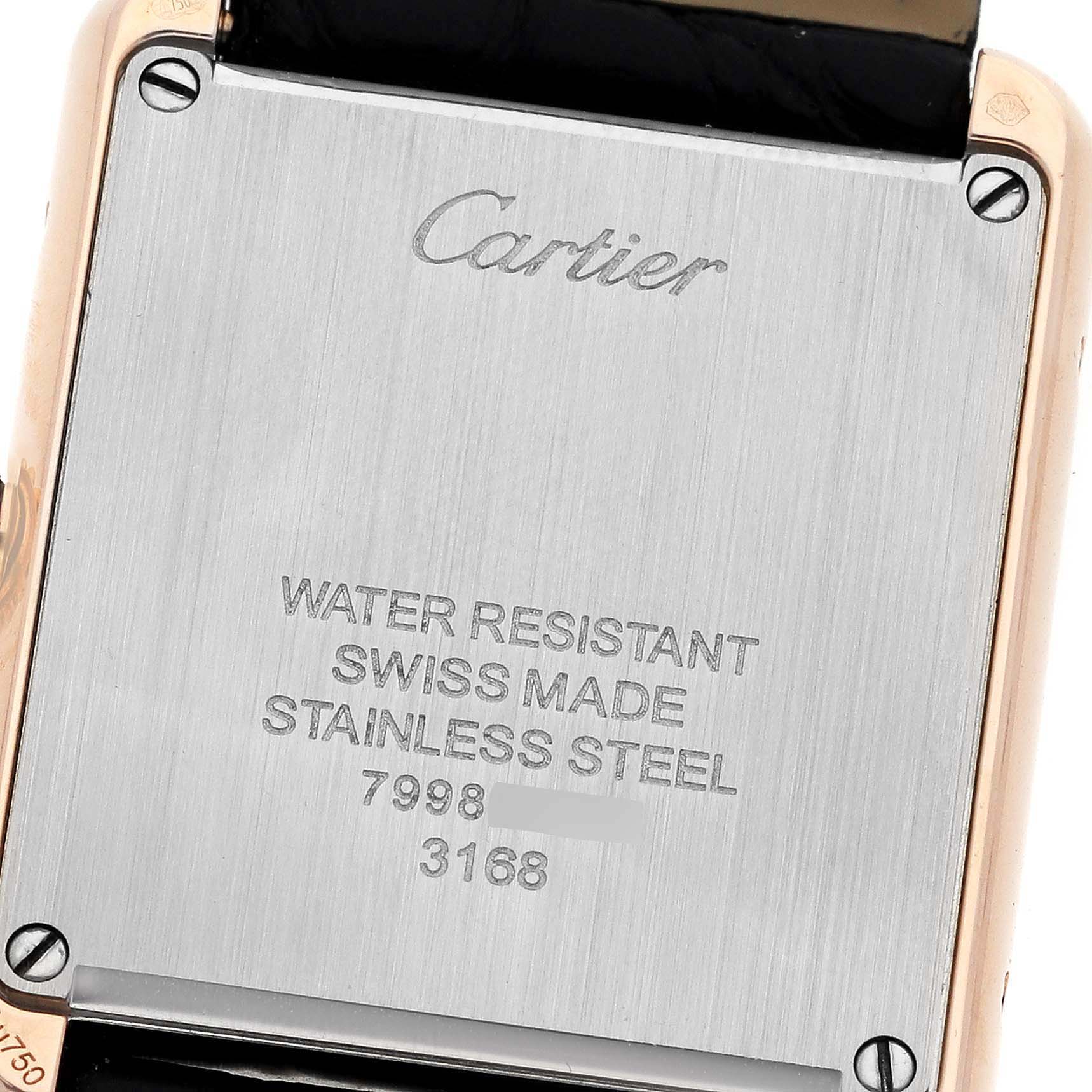 The image shows the back case of a Cartier Tank Solo W5200024 Women
s Steel and Gold (two tone) Silver Dial W5200024 Women
s Steel and Gold (two tone) Silver Dial watch, highlighting its water resistance, stainless steel material, and serial numbers.