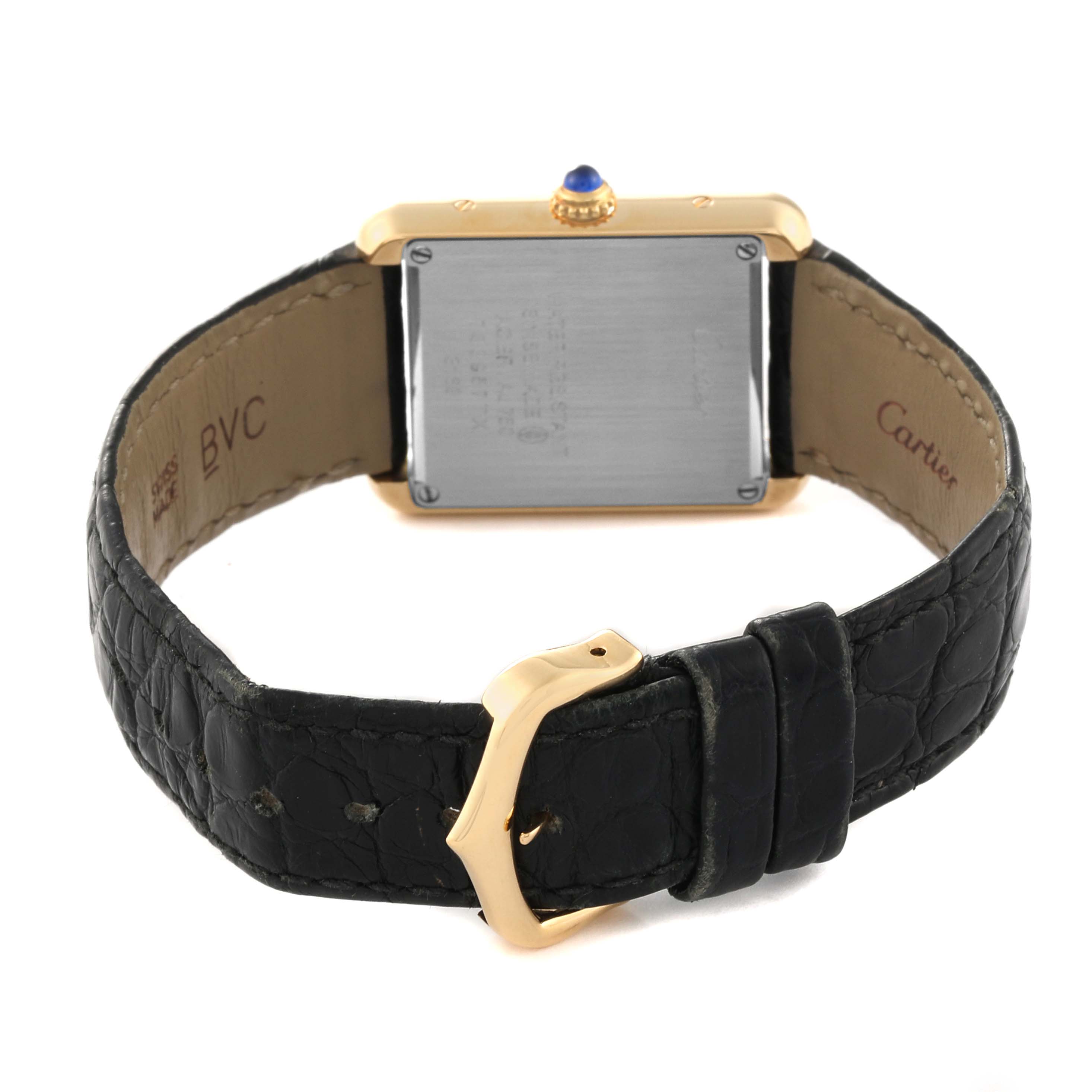 The image shows the back view of a Cartier Tank Solo W5200002 Women
s Steel and Gold (two tone) Silver Dial W5200002 Women
s Steel and Gold (two tone) Silver Dial watch, highlighting its black leather strap and gold buckle.