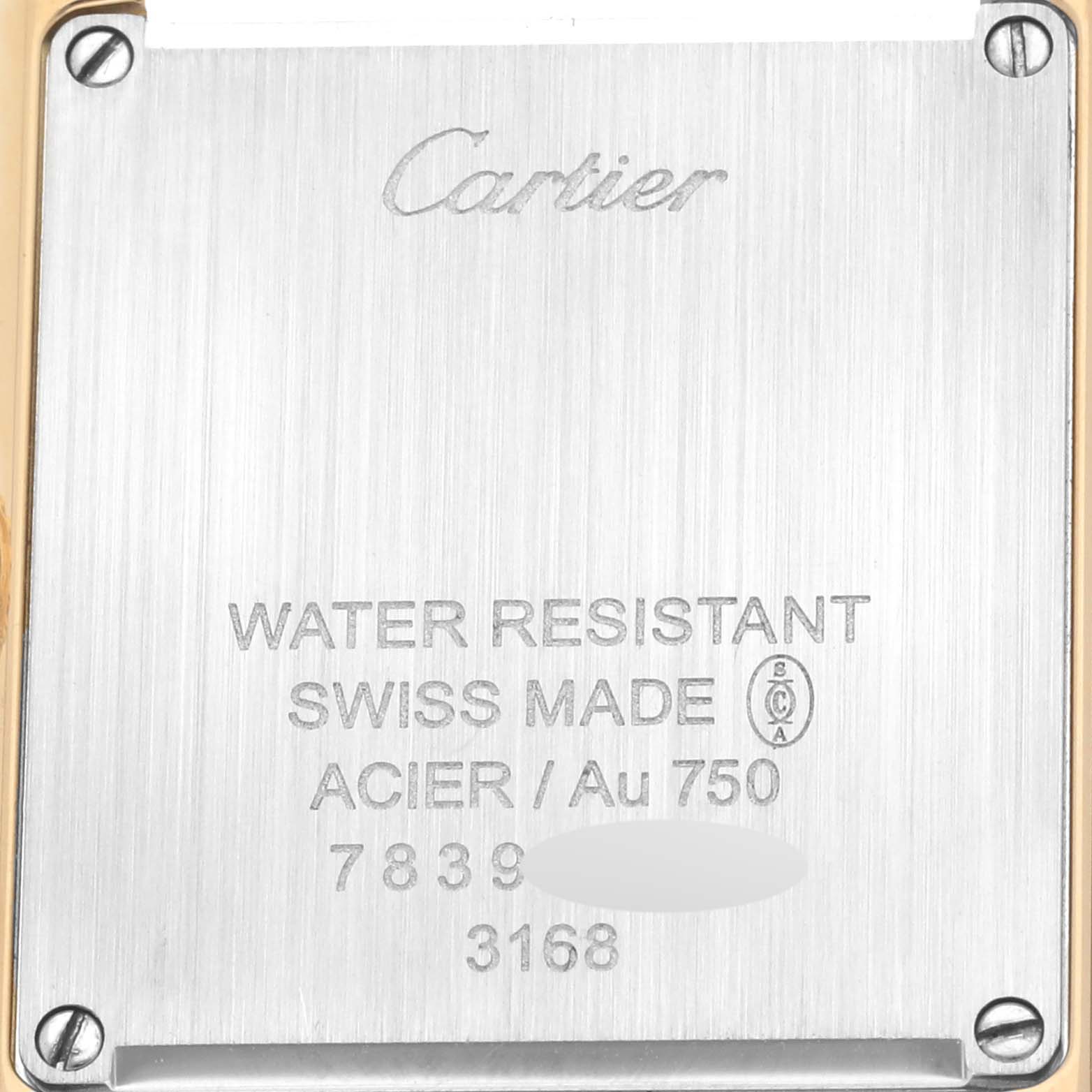 This is the back case of a Cartier Tank Solo W5200002 Women
s Steel and Gold (two tone) Silver Dial W5200002 Women
s Steel and Gold (two tone) Silver Dial watch, showing engravings and water resistance information.