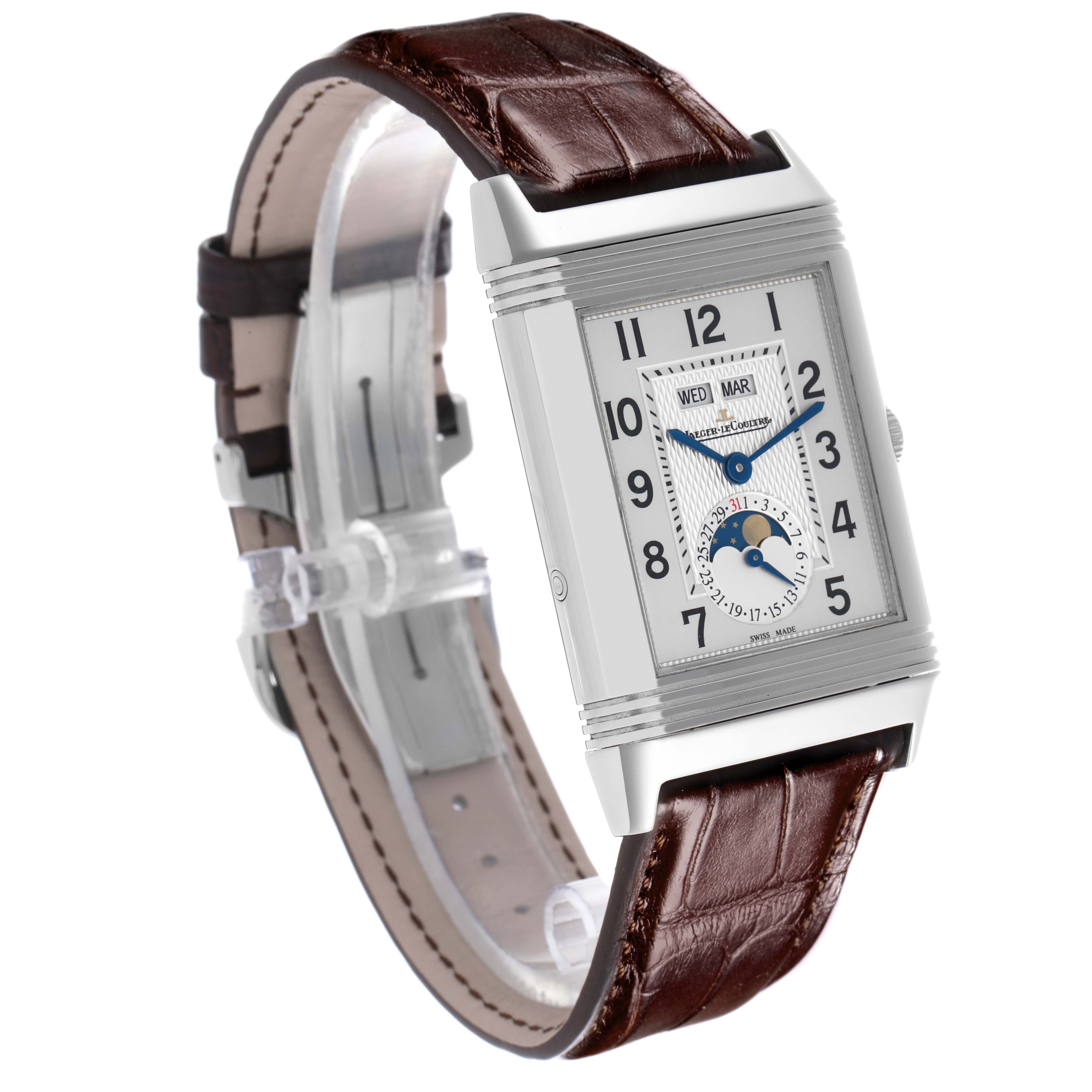 The Jaeger-LeCoultre Reverso watch is shown at a three-quarter angle, highlighting its face and brown leather strap.