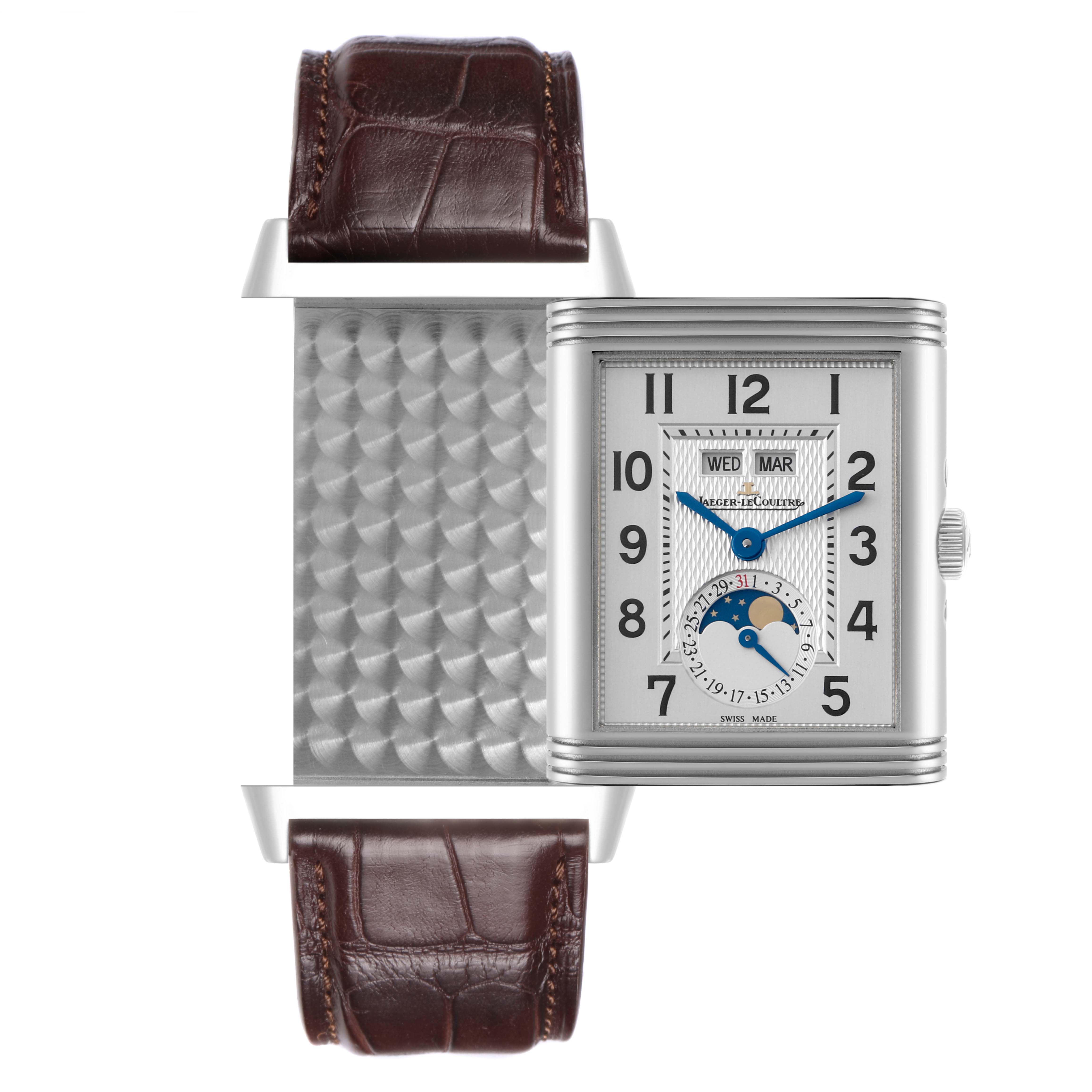 The Jaeger-LeCoultre Reverso watch is shown from the front with its distinctive rectangular case and visible strap.
