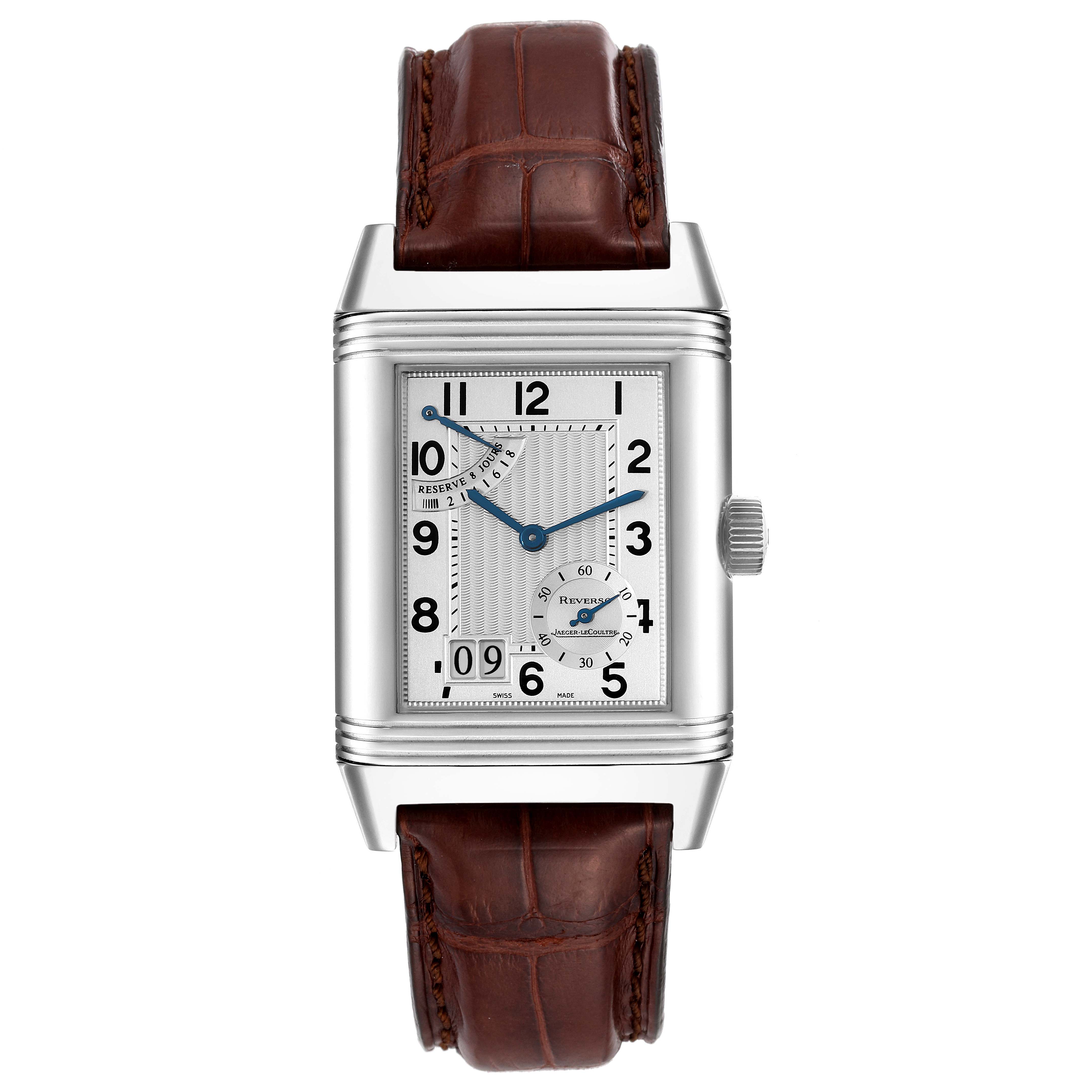 The Jaeger LeCoultre Reverso Q3008420 Men's Stainless Steel Silver Dial Q3008420 Men's Stainless Steel Silver Dial watch is shown from a front angle, displaying its rectangular silver dial, brown leather strap, and crown.