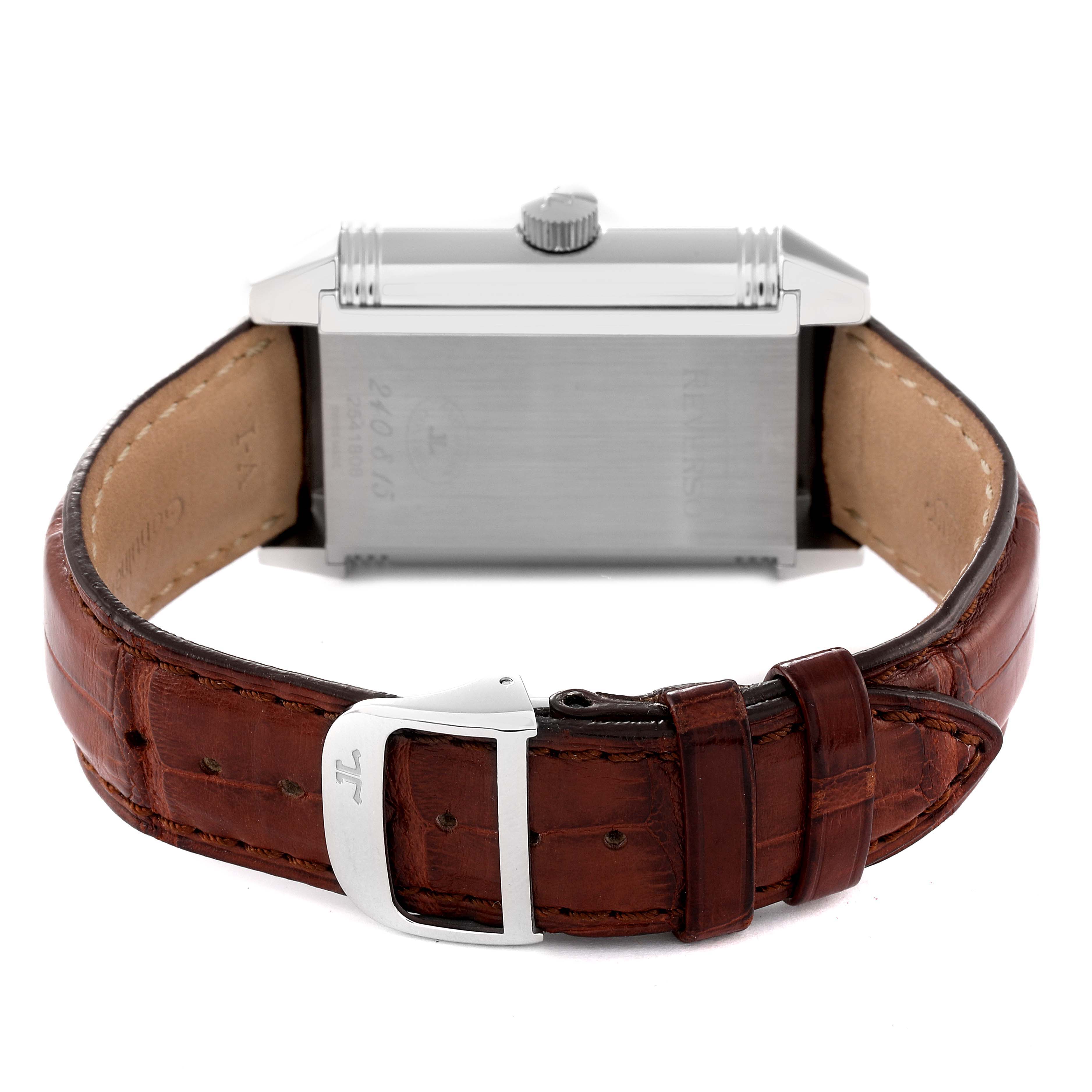 The image shows the back view of a Jaeger LeCoultre Reverso Q3008420 Men's Stainless Steel Silver Dial Q3008420 Men's Stainless Steel Silver Dial watch, highlighting its metal case, crown, and brown leather strap with a buckle.