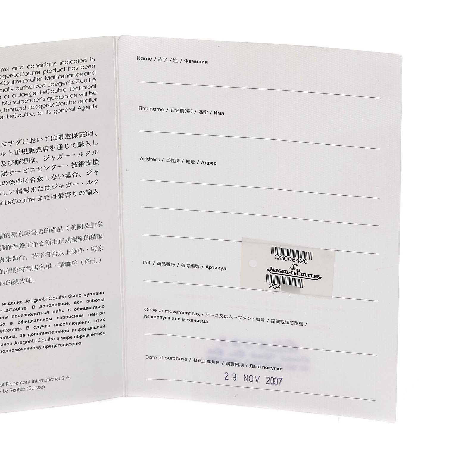 The image shows the open warranty booklet for a Jaeger LeCoultre Reverso Q3008420 Men's Stainless Steel Silver Dial Q3008420 Men's Stainless Steel Silver Dial watch viewed from a slight angle.