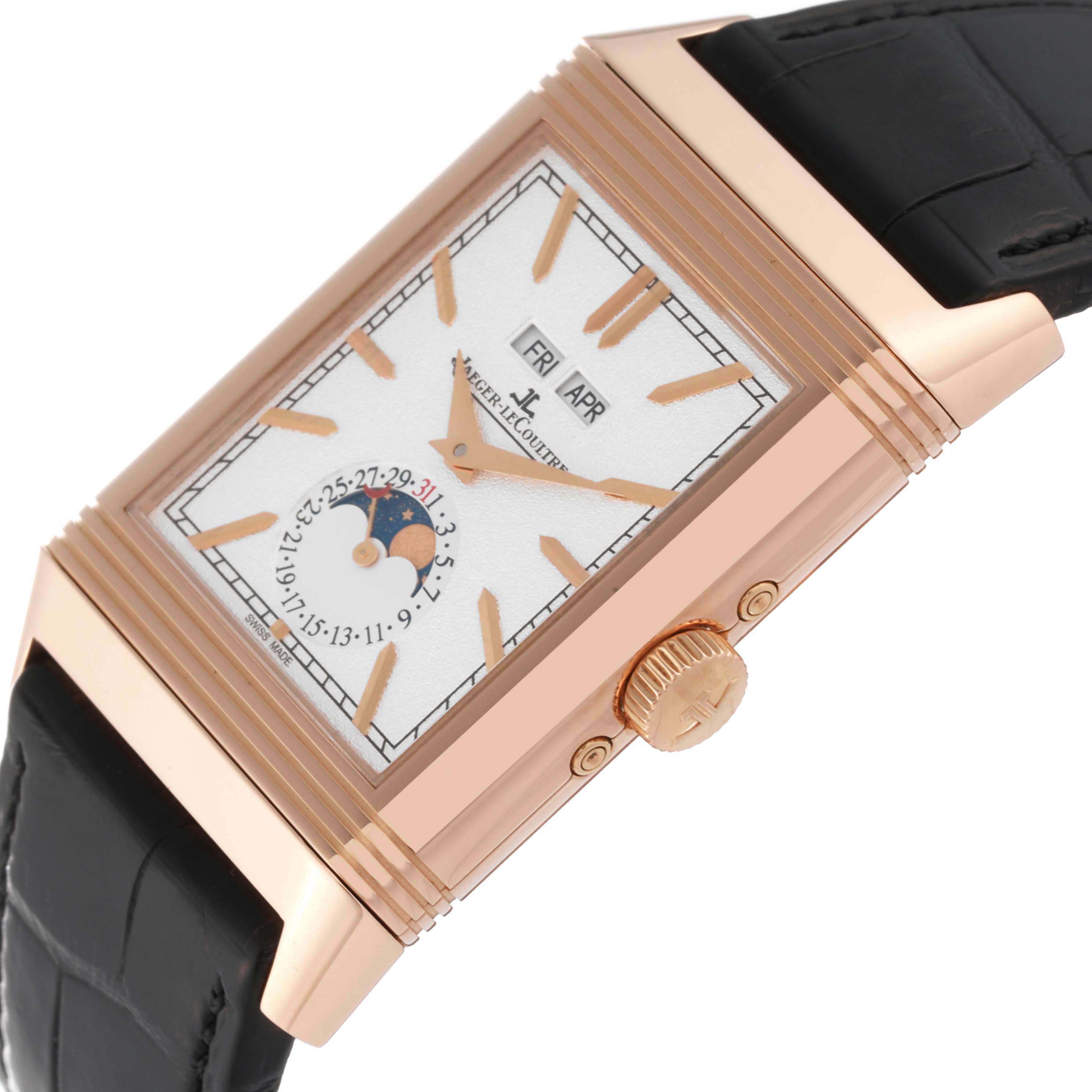 The image shows a Jaeger-LeCoultre Reverso watch angled to highlight the dial, crown, and part of the black strap.
