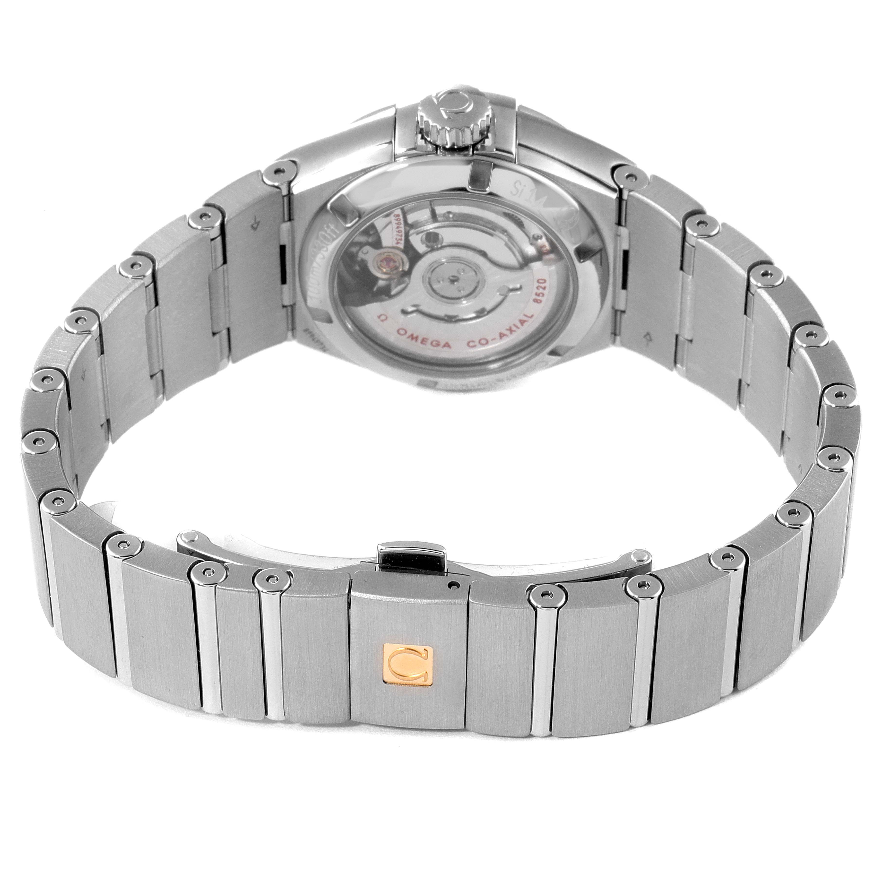 The image shows the back and bracelet of an Omega 123.15.27.20.51.001 Women
s Stainless Steel Black Dial 123.15.27.20.51.001 Women
s Stainless Steel Black Dial Constellation 27 Black Dial Diamond Watch 123.15.27.20.51.001 (Unworn).