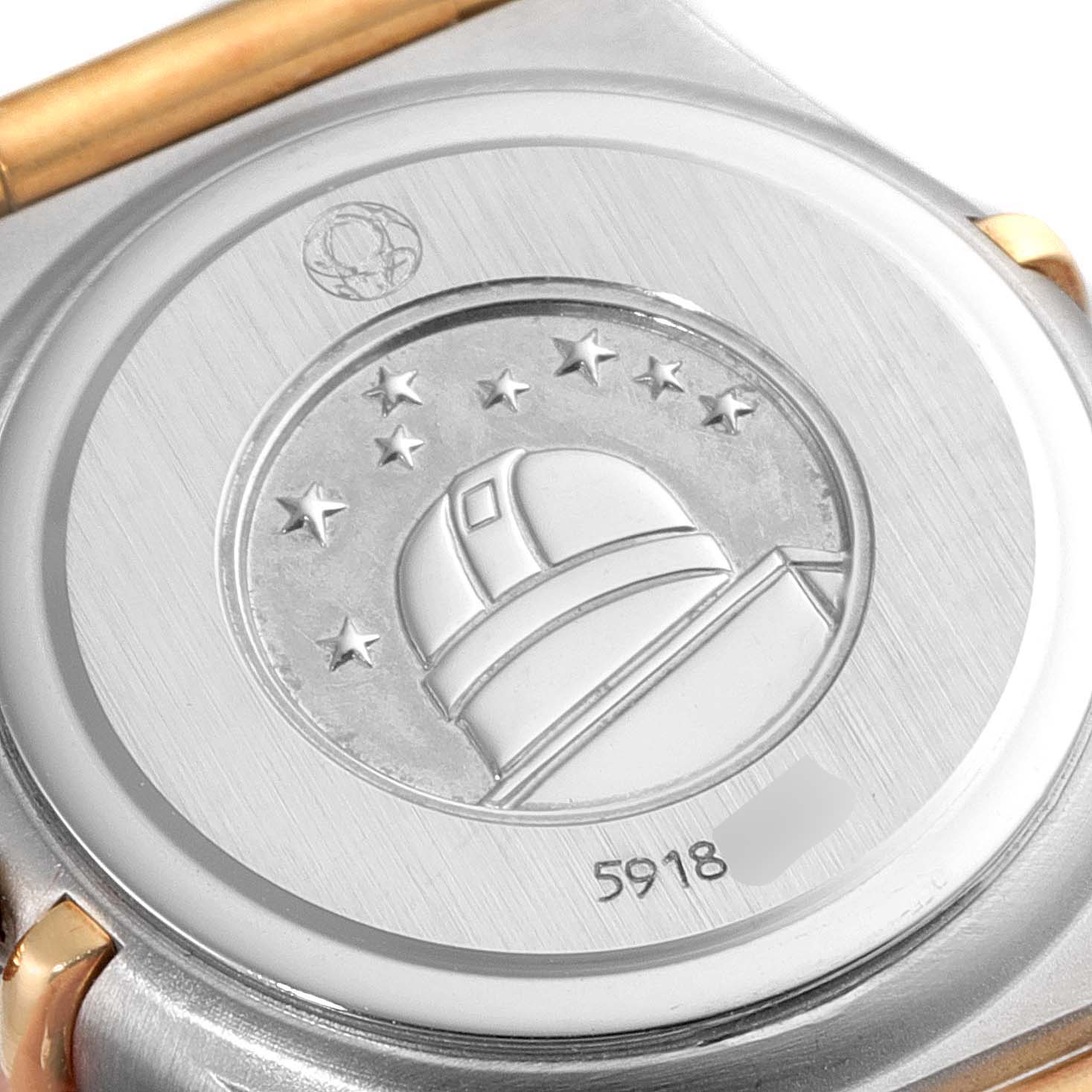 This image shows the case back of an Omega 1267.70.00 Women
s Steel and Gold (two tone) Mother of Pearl Dial 1267.70.00 Women
s Steel and Gold (two tone) Mother of Pearl Dial Constellation Steel Yellow Gold MOP Diamond Watch 1267.70.00 with an observatory engraving.