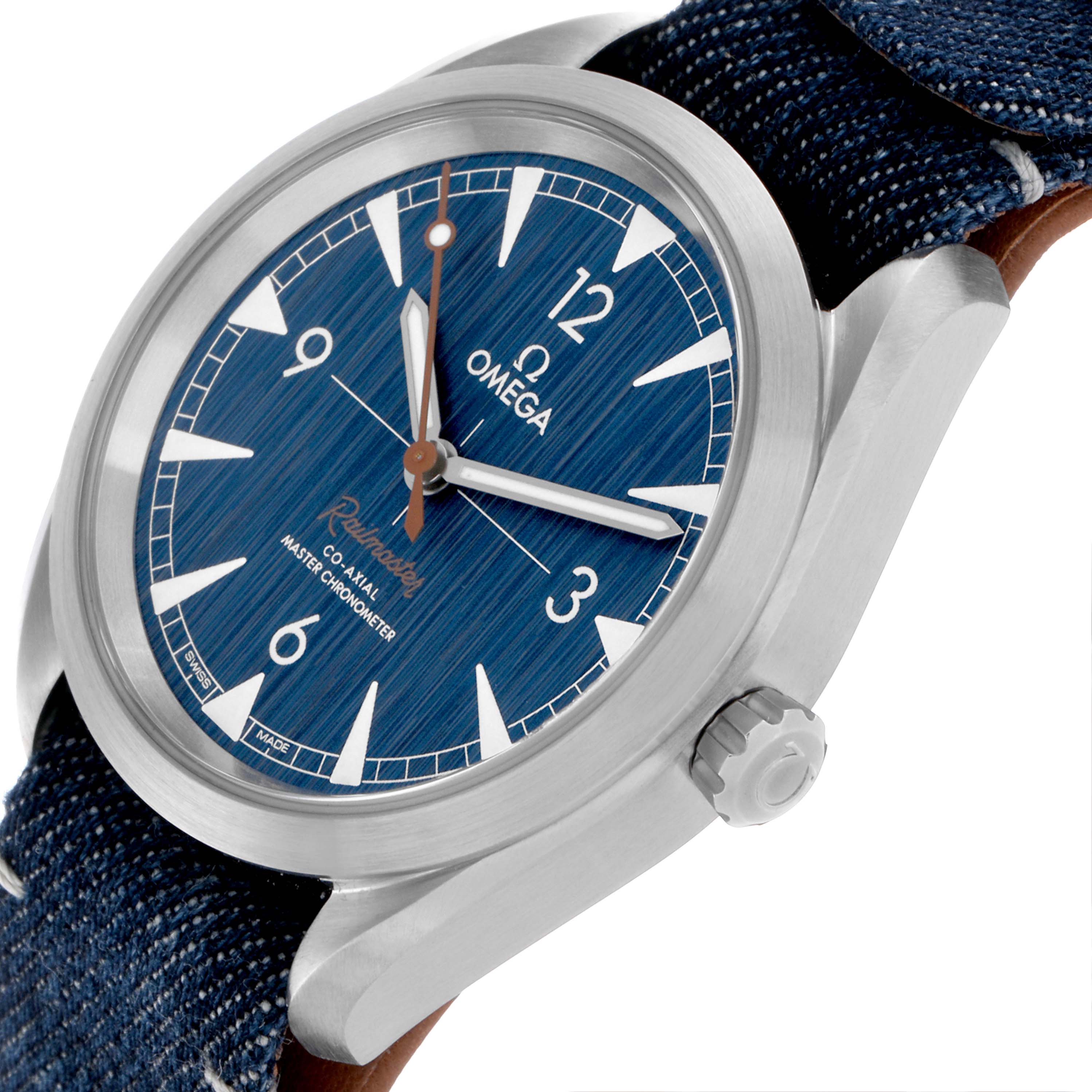 The Omega Aqua Terra 220.12.40.20.01.001 Men's Stainless Steel Blue Dial 220.12.40.20.01.001 Men's Stainless Steel Blue Dial watch is shown at an angle highlighting the dial, bezel, crown, and denim strap.