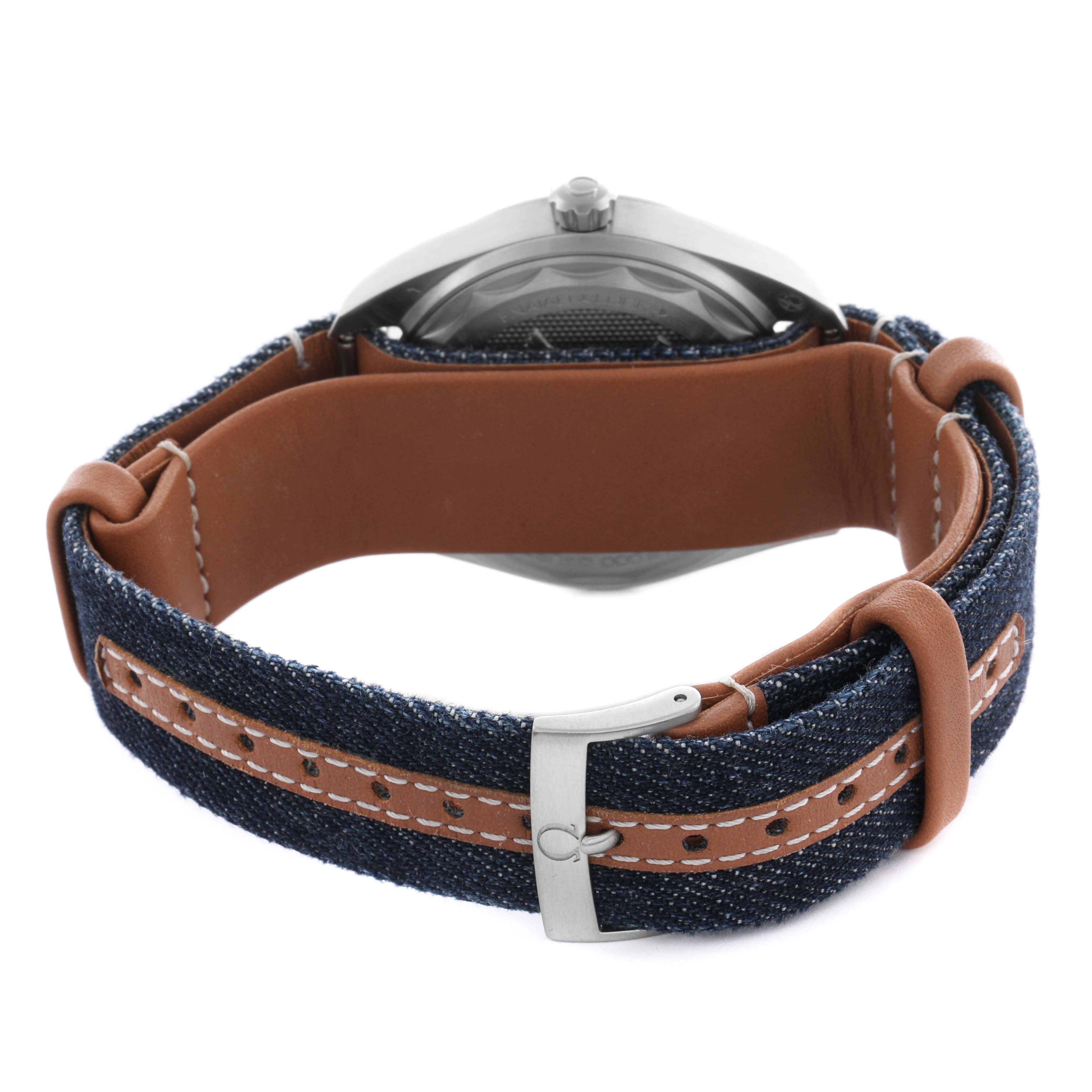 The image shows the Omega Aqua Terra 220.12.40.20.01.001 Men's Stainless Steel Blue Dial 220.12.40.20.01.001 Men's Stainless Steel Blue Dial watch from a rear angle, highlighting its denim strap and stainless steel clasp.