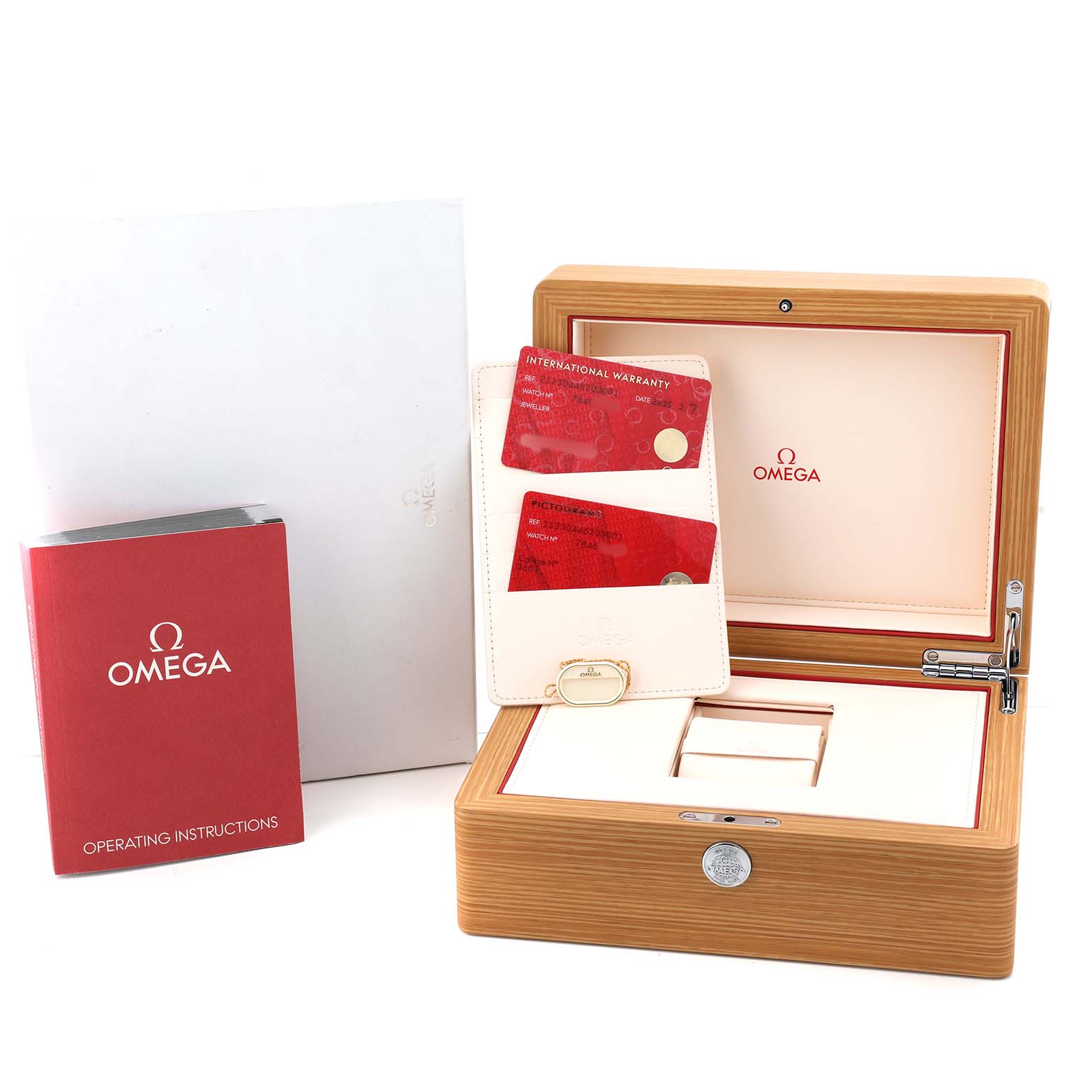 The image shows an Omega Seamaster 212.30.44.52.03.001 Men's Stainless Steel Blue Dial watch box, instruction manual, warranty cards, and cardholder from a front angle.