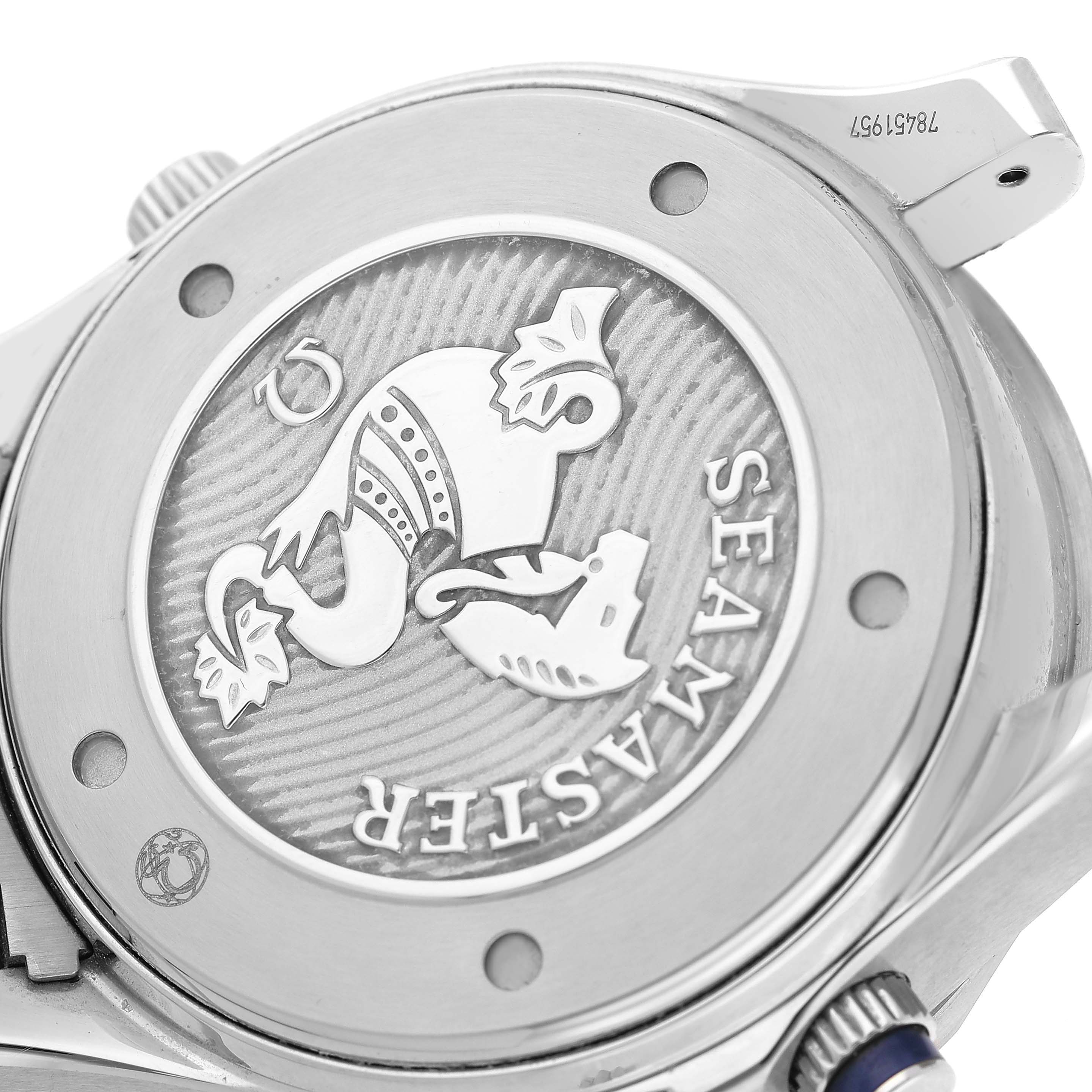 The image shows the case back of an Omega Seamaster 212.30.44.52.03.001 Men's Stainless Steel Blue Dial watch, featuring its engraved emblem and surrounding metal parts.