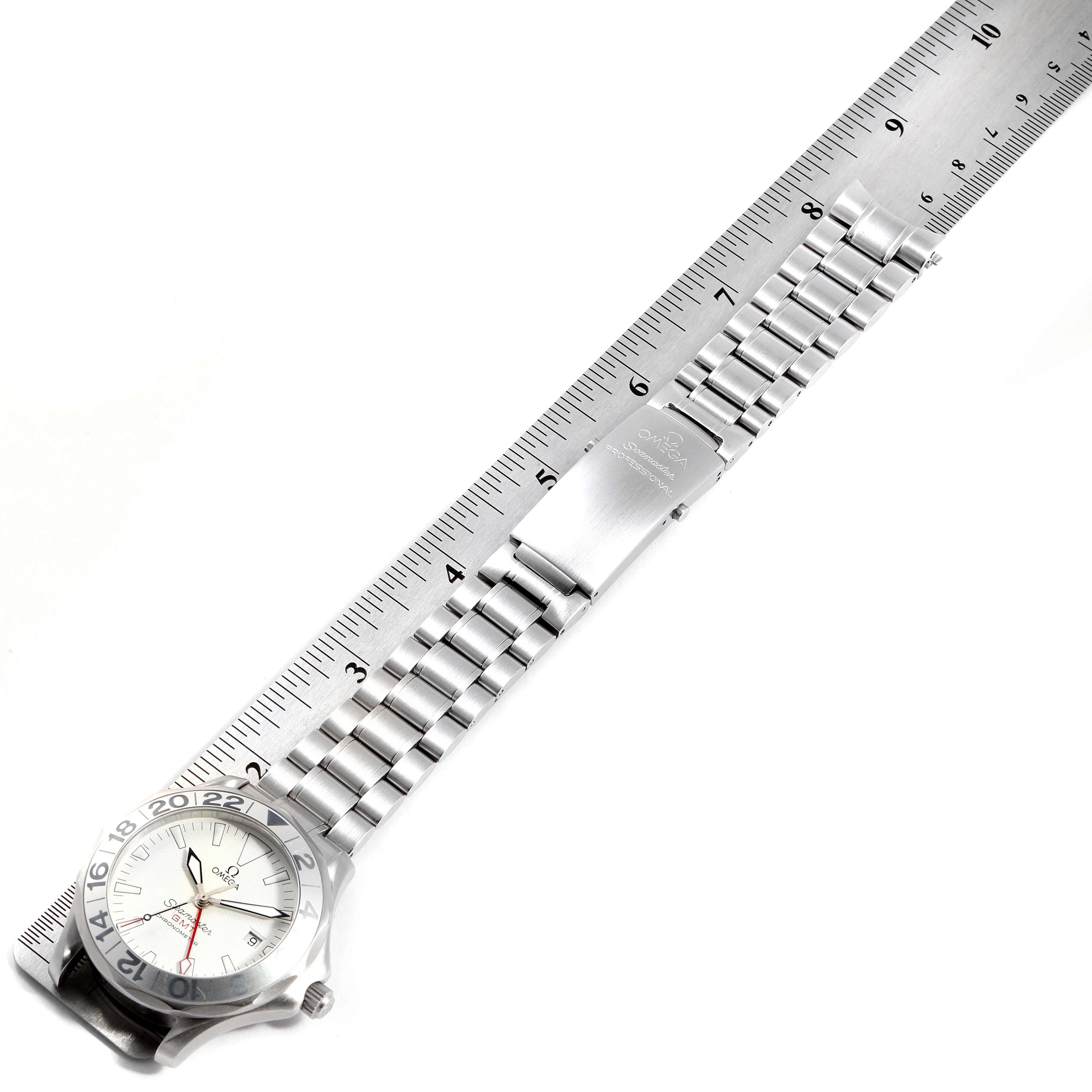 The image shows an Omega Seamaster 2538.20.00 Men's Stainless Steel White Dial 2538.20.00 Men's Stainless Steel White Dial watch and bracelet band laid flat alongside a ruler for measurement.
