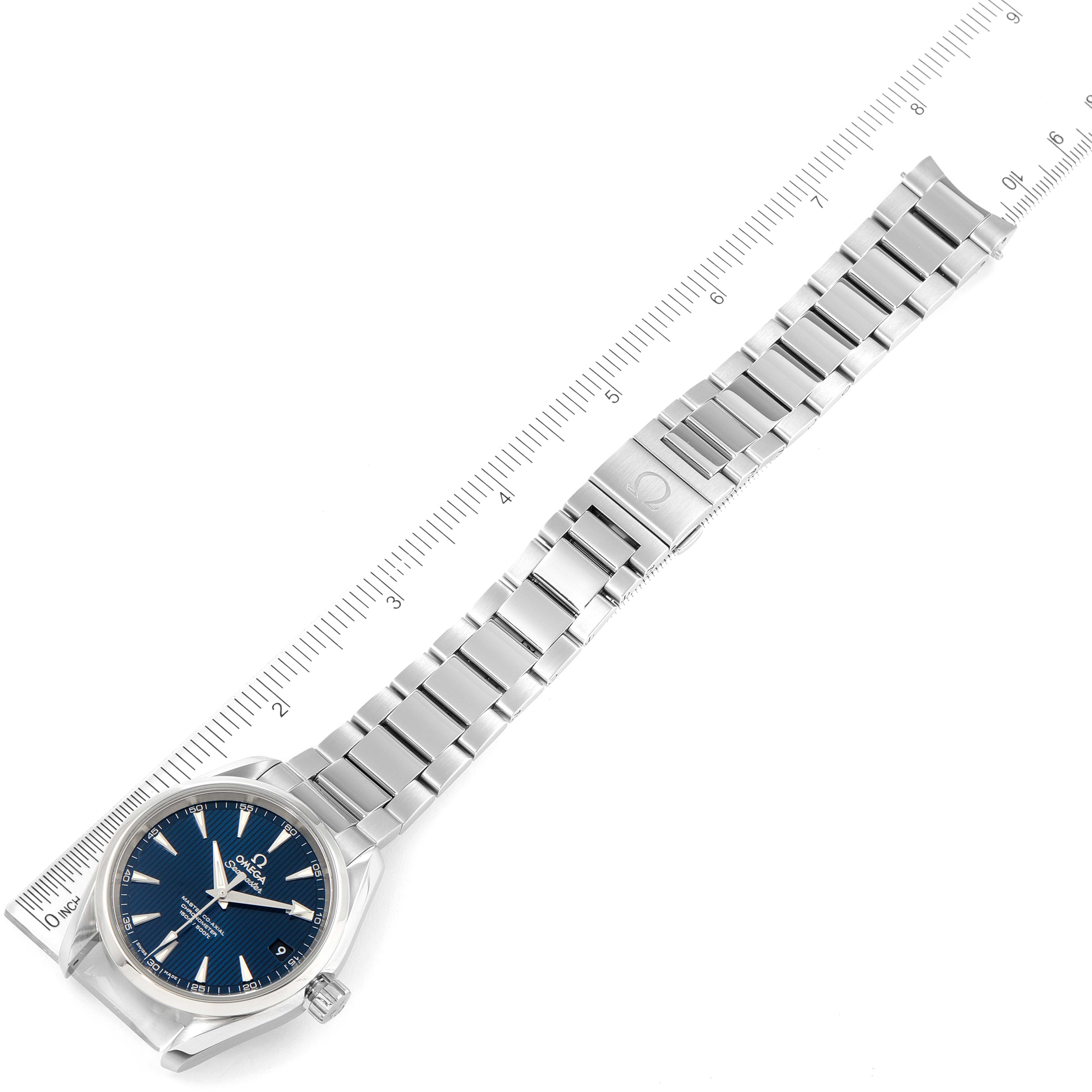 The Omega Aqua Terra 231.10.39.21.03.002 Men's Stainless Steel Blue Dial 231.10.39.21.03.002 Men's Stainless Steel Blue Dial watch is shown flat with a full view of the face, bracelet, and clasp alongside a ruler for scale.