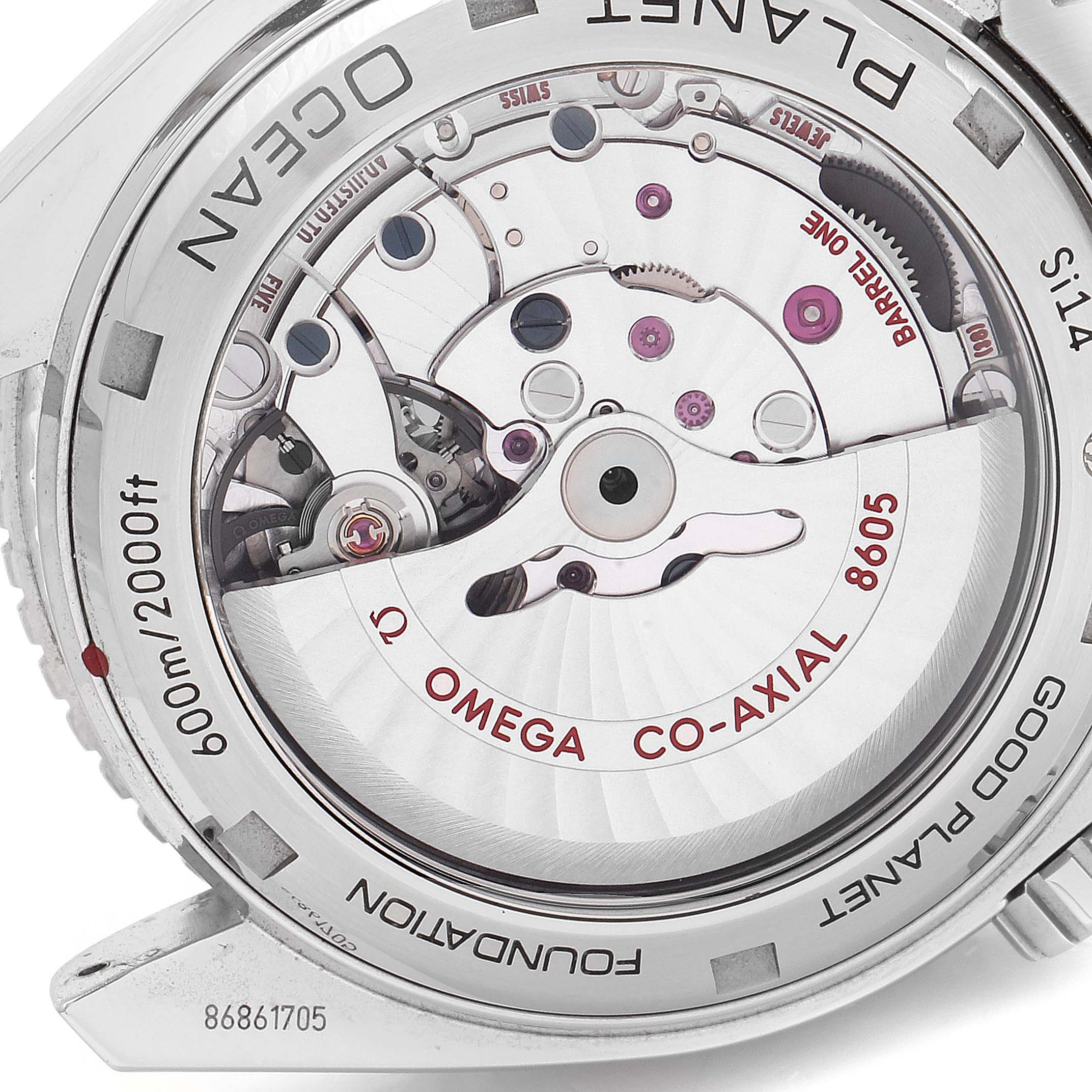 The image shows the back case of the Omega Planet Ocean 232.30.44.22.03.001 Men's Stainless Steel Blue Dial 232.30.44.22.03.001 Men's Stainless Steel Blue Dial watch, showcasing its intricate movement and co-axial mechanism.