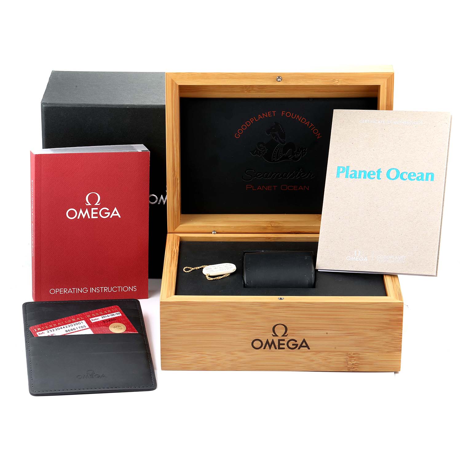 The image shows the packaging and accessories for an Omega Planet Ocean 232.30.44.22.03.001 Men's Stainless Steel Blue Dial 232.30.44.22.03.001 Men's Stainless Steel Blue Dial watch, including the box, manuals, and warranty card.