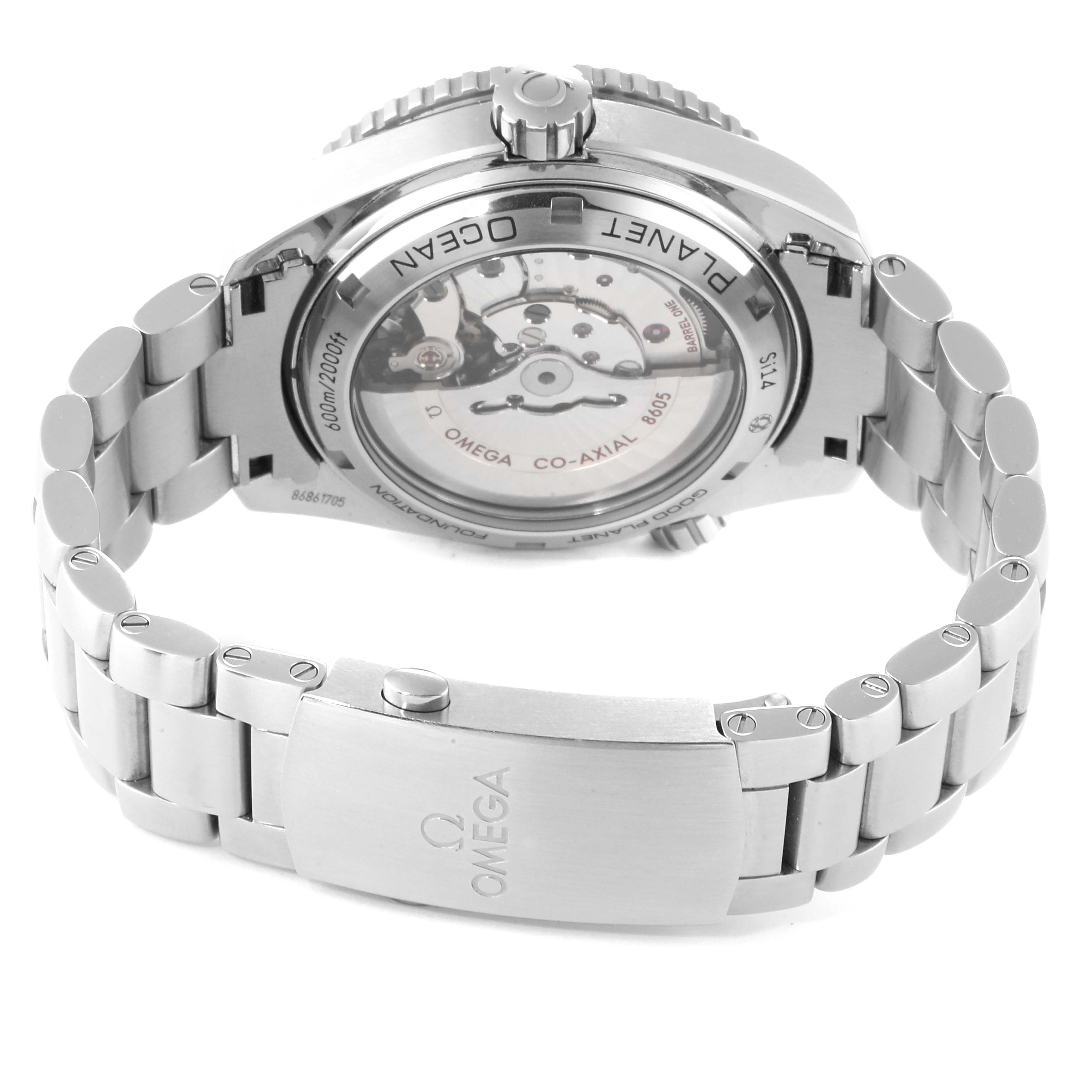 The image shows the back view of the Omega Planet Ocean 232.30.44.22.03.001 Men's Stainless Steel Blue Dial 232.30.44.22.03.001 Men's Stainless Steel Blue Dial watch, highlighting its transparent case back and stainless steel bracelet.