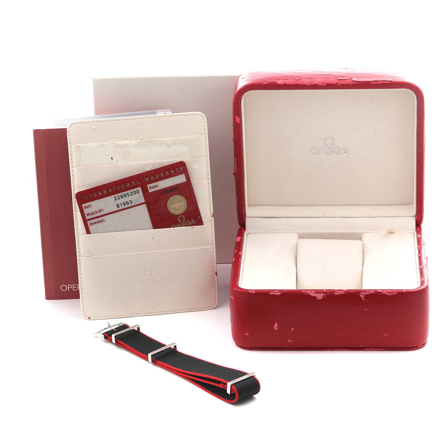 The image shows a red Omega watch box, a warranty card, a manual, and an additional strap for the Omega Seamaster 2269.52.00 Men's Titanium Black Dial 2269.52.00 Men's Titanium Black Dial model.