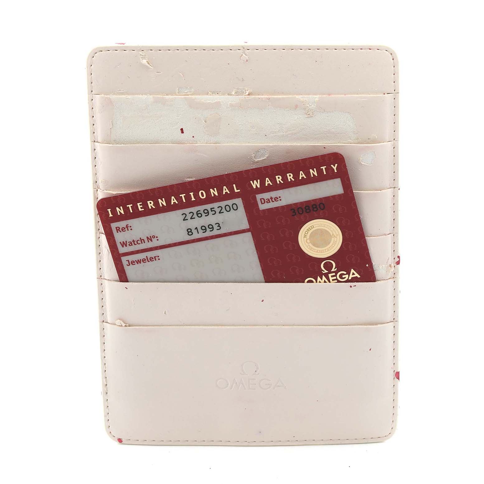 The image shows an Omega Seamaster 2269.52.00 Men's Titanium Black Dial 2269.52.00 Men's Titanium Black Dial International Warranty card in a white cardholder, viewed from the front.