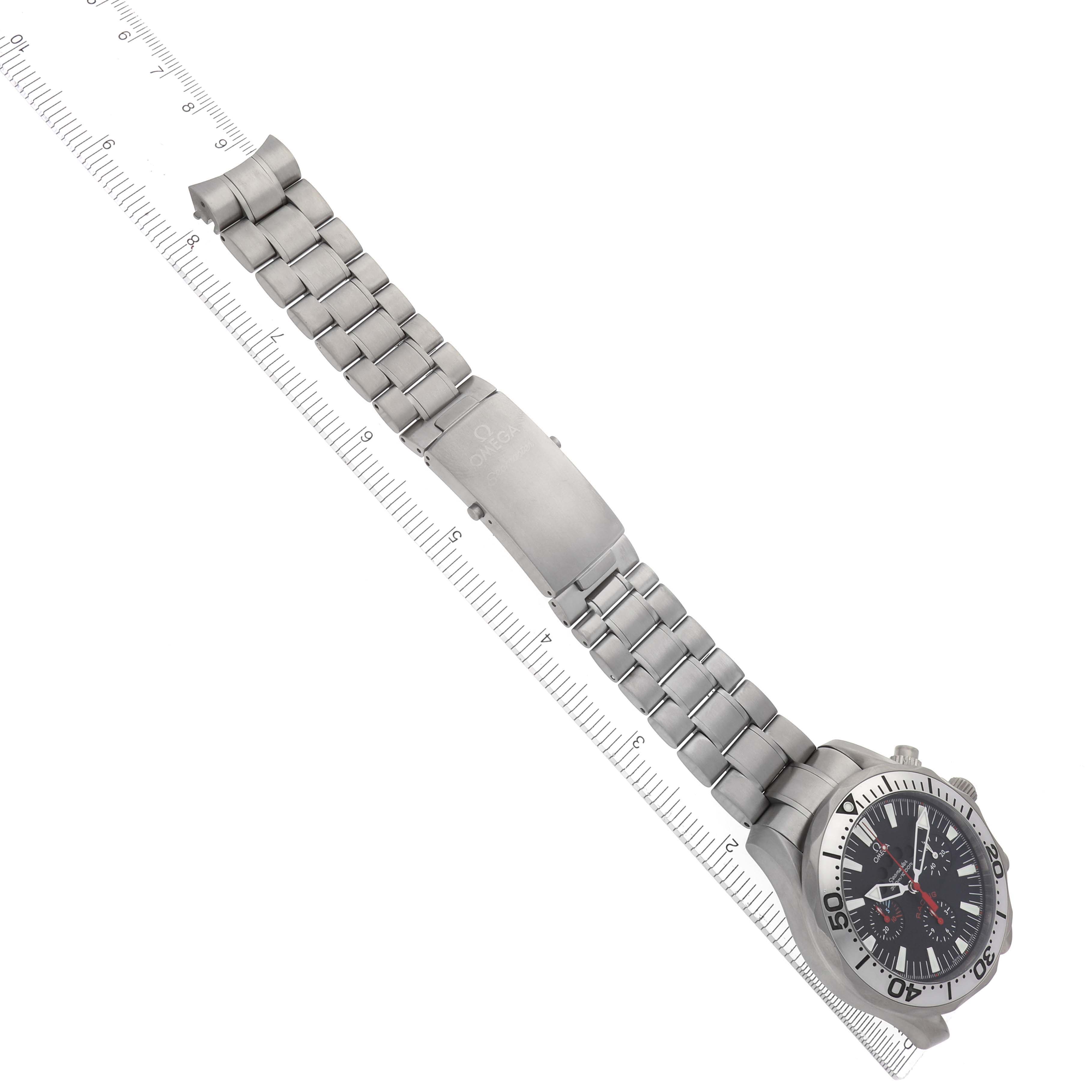 The Omega Seamaster 2269.52.00 Men's Titanium Black Dial 2269.52.00 Men's Titanium Black Dial watch is shown at a diagonal angle, displaying its face, bezel, and metal bracelet with a ruler for scale.