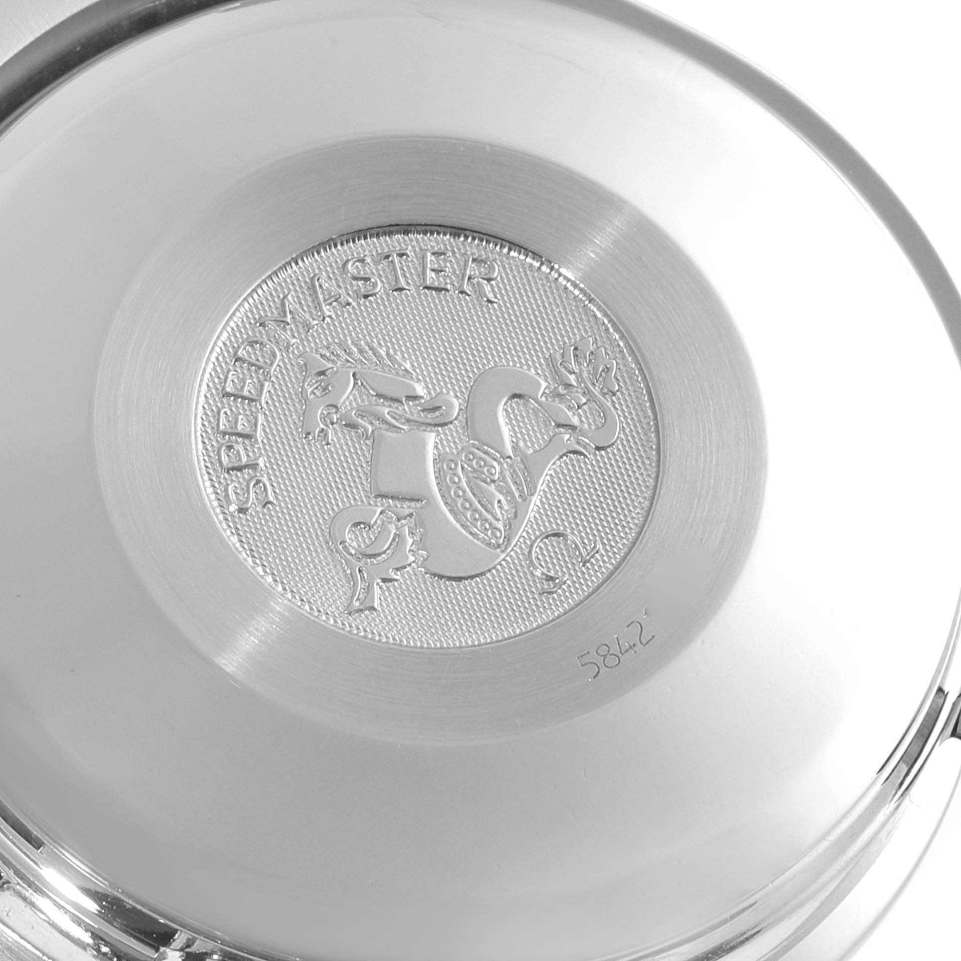 This image shows the back case of an Omega Speedmaster 3513.51.00 Men
s Stainless Steel Black Dial 3513.51.00 Men
s Stainless Steel Black Dial watch with an embossed design and text.