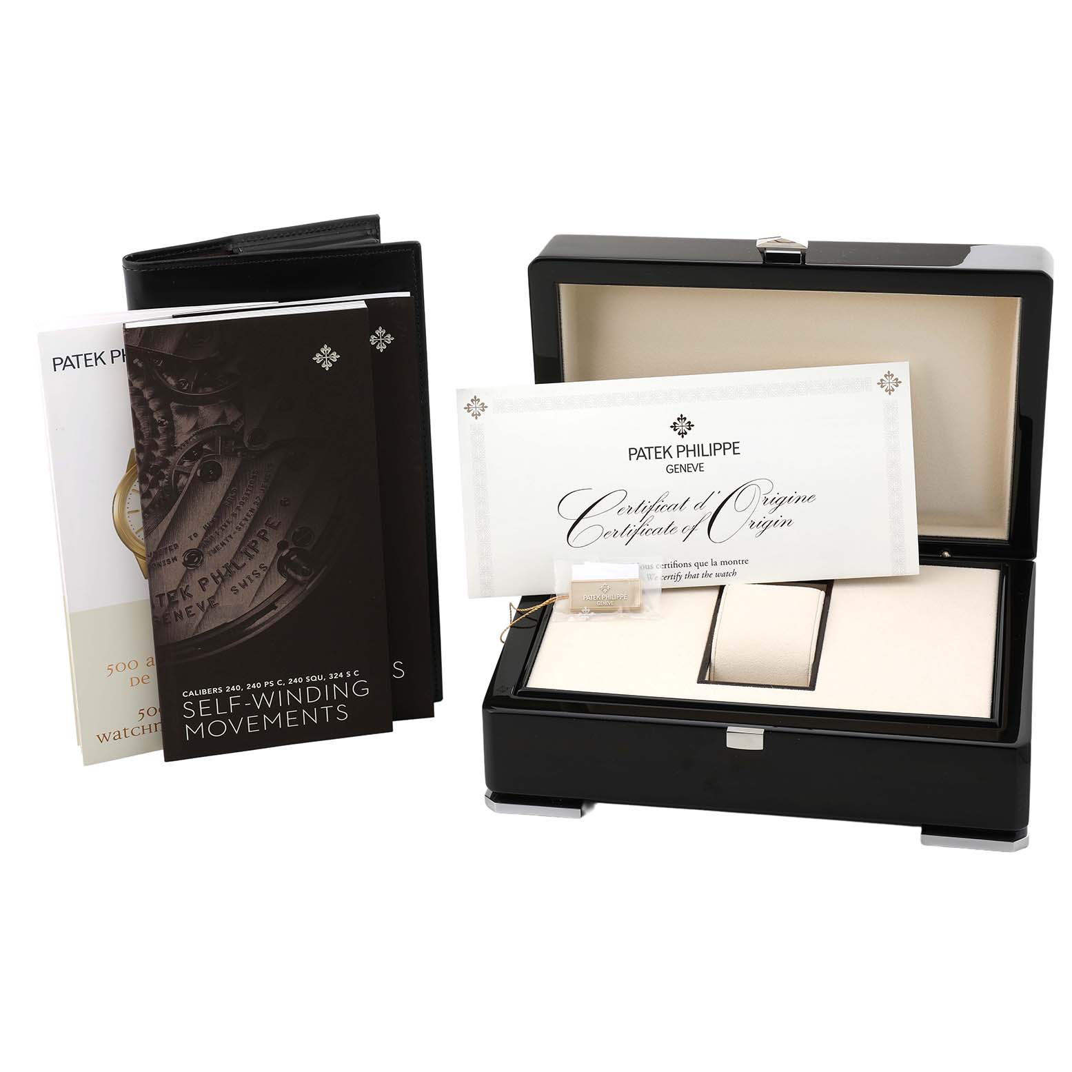 The image shows a Patek Philippe Aquanaut 5072R-001 Women's Rose Gold Mother of Pearl Dial box set with an open box, certificates, and booklets displayed at an angle.