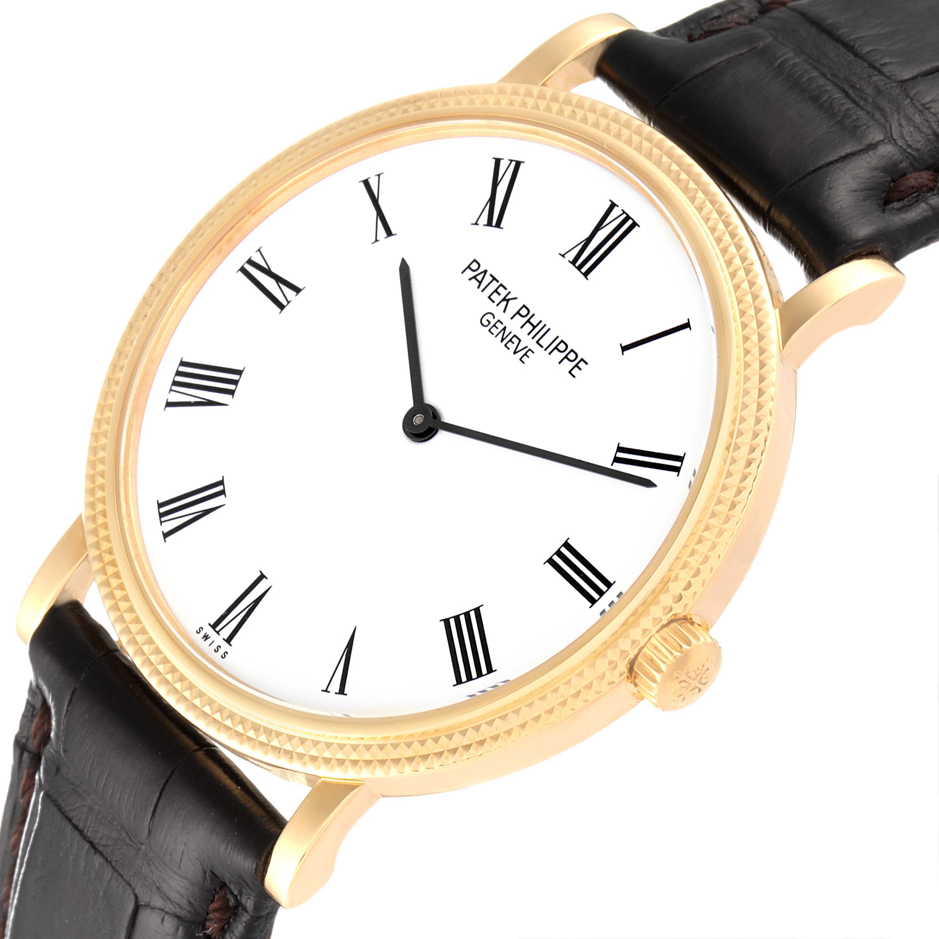The Patek Philippe Calatrava 5120J Men
s Yellow Gold White Dial 5120J Men
s Yellow Gold White Dial watch is shown from an angled top view, highlighting the dial, bezel, crown, and part of the leather strap.