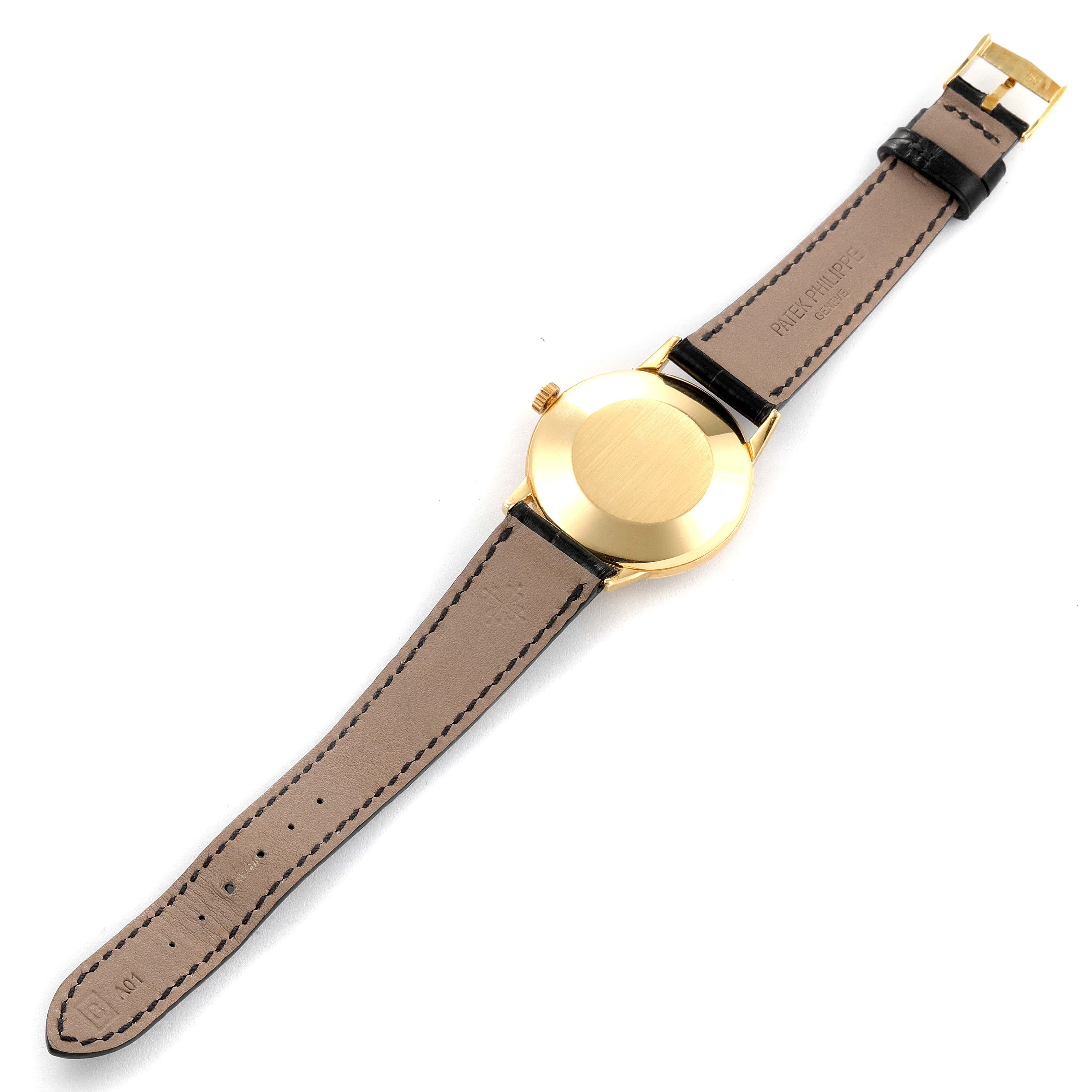 The image shows the back of a Patek Philippe Vintage model watch, highlighting the leather strap, buckle, and case back.