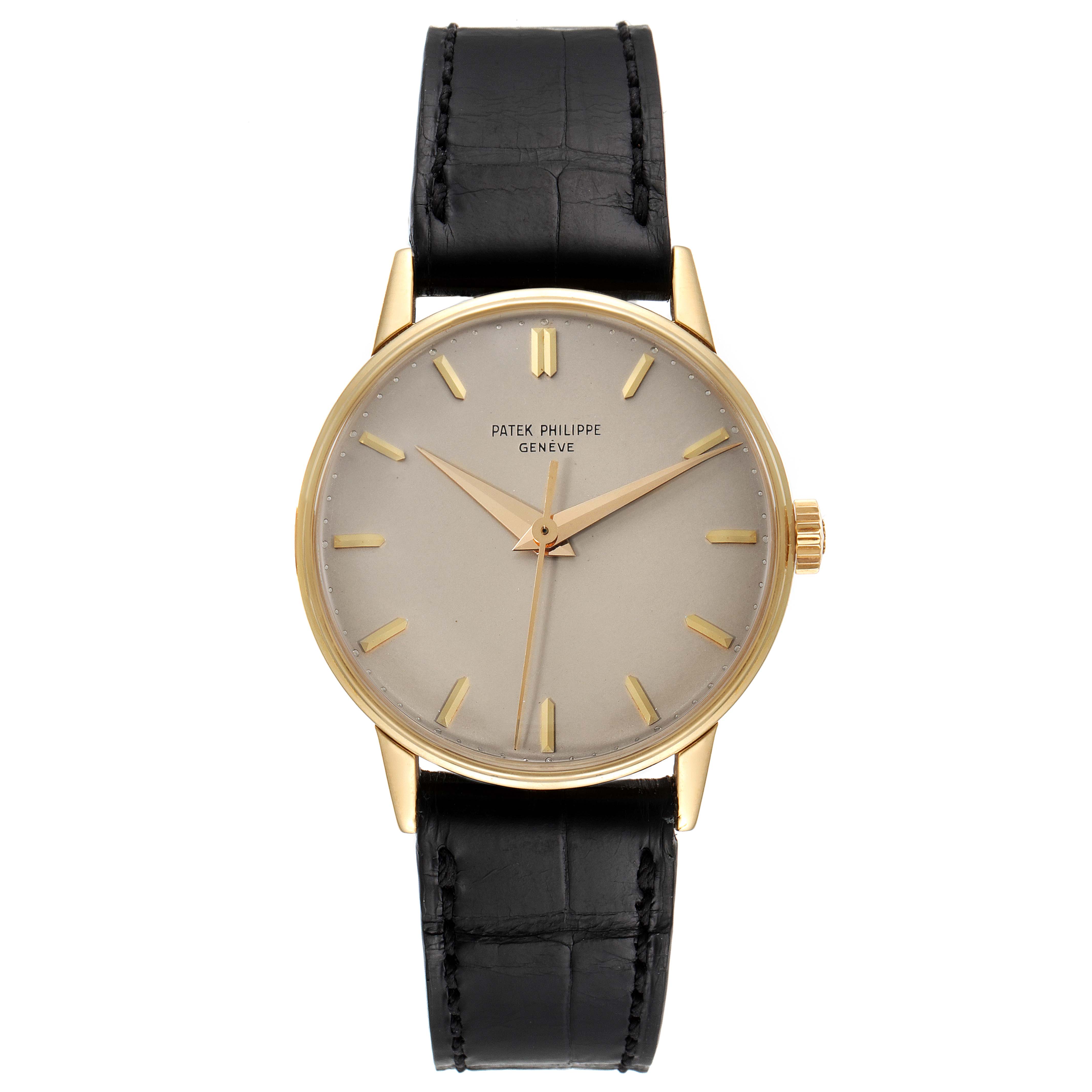 This Vintage model by Patek Philippe is shown from a front angle, displaying the dial, hands, case, and black leather strap.