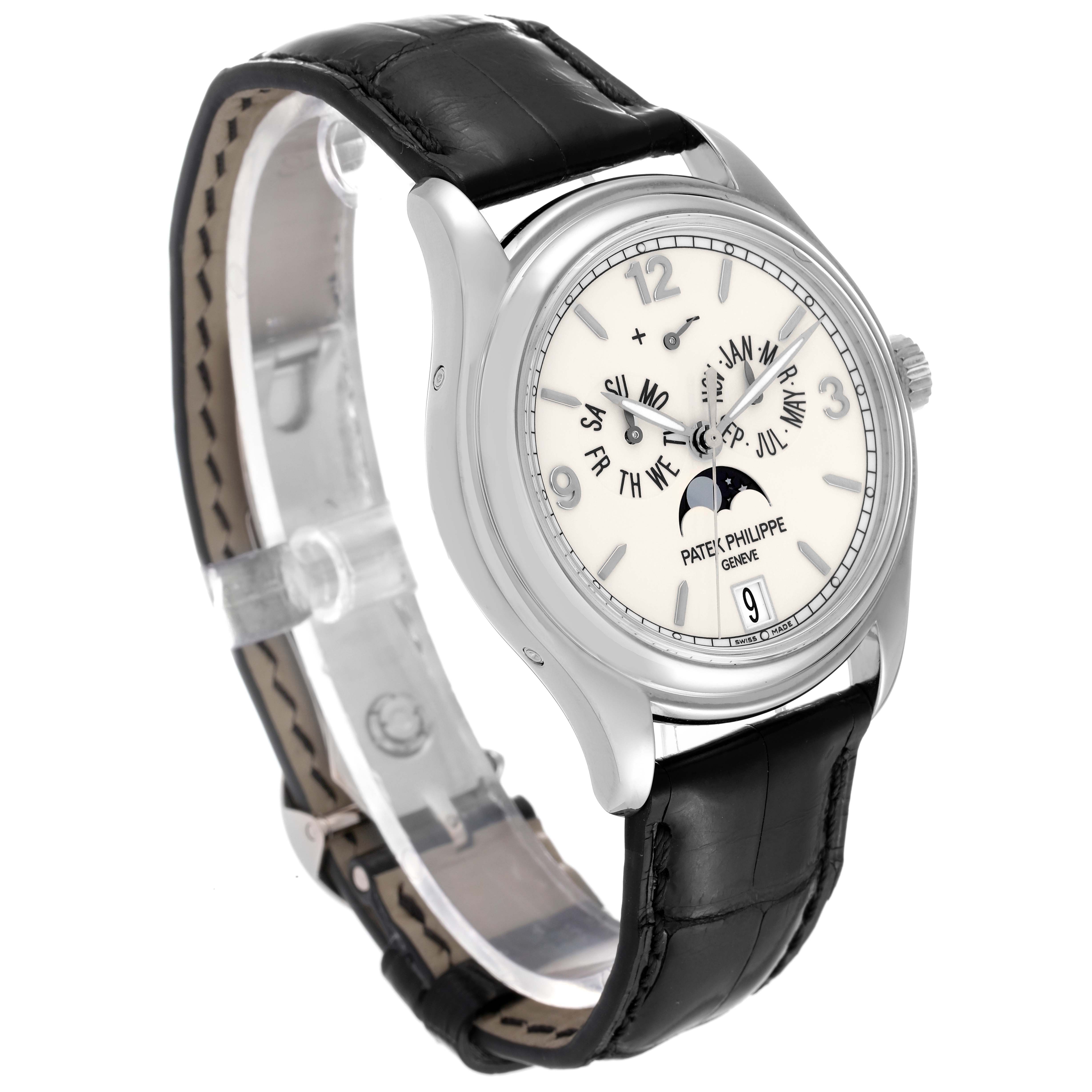 This image shows a Patek Philippe Complications 5146G-001 Men's White Gold Beige Dial 5146G-001 Men's White Gold Beige Dial model watch from a front-left angle, displaying its dial, case, and leather strap.