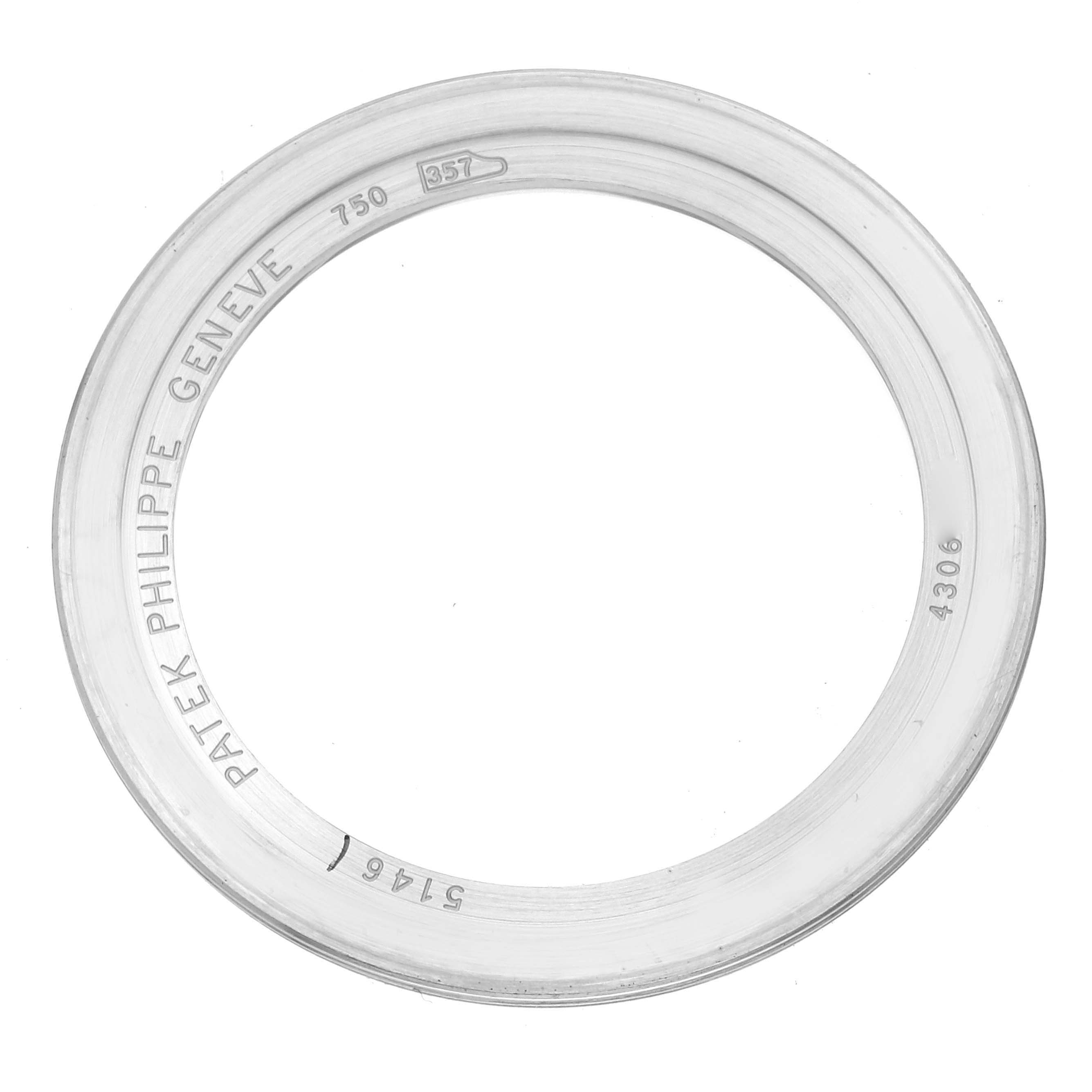 The image shows a circular bezel from a Complications model by Patek Philippe, viewed from above.