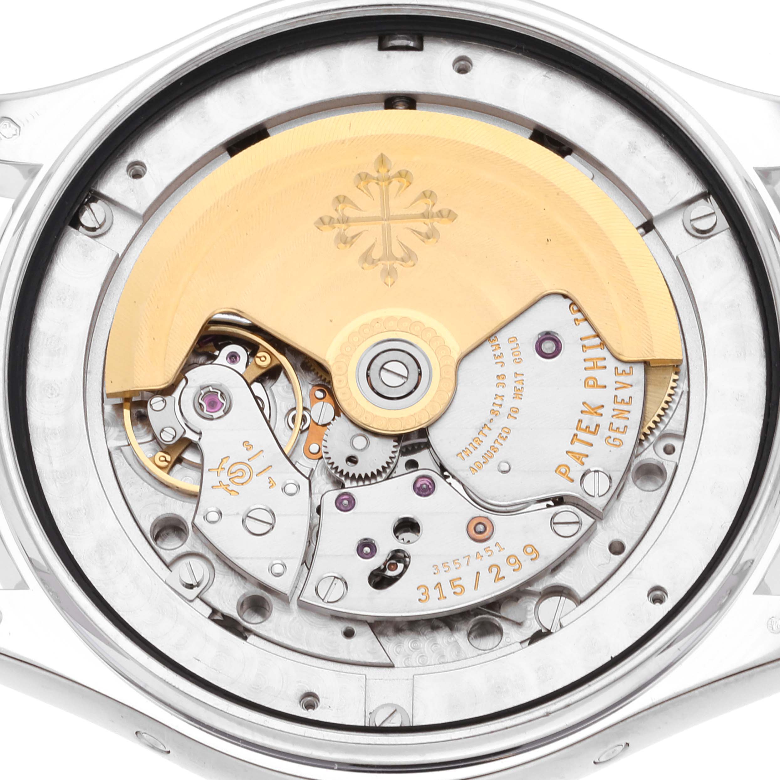 The image shows the intricate rear view of the Patek Philippe Complications 5146G-001 Men's White Gold Beige Dial 5146G-001 Men's White Gold Beige Dial watch, focusing on its movement and components.