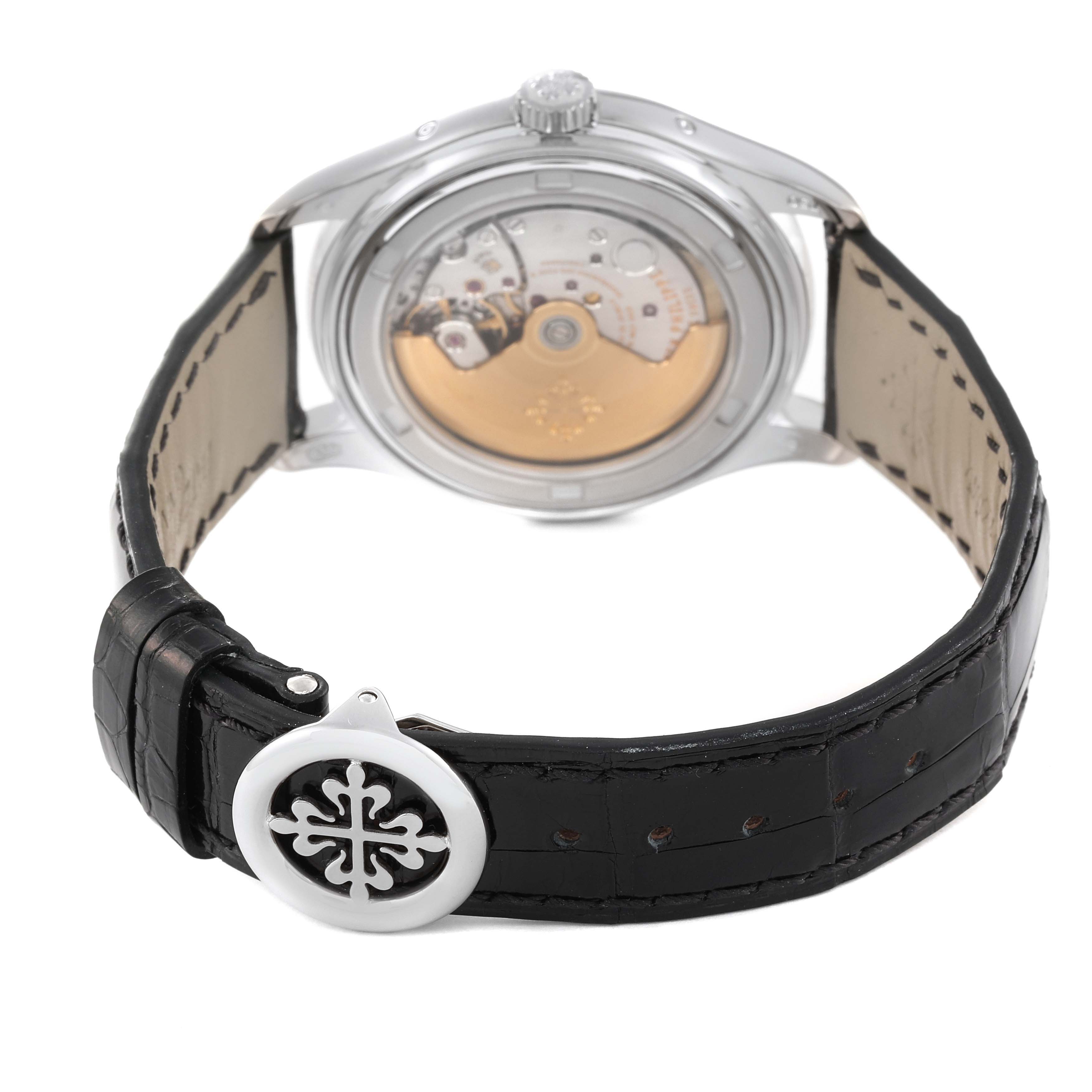 This image shows the back view of the Patek Philippe Complications 5146G-001 Men's White Gold Beige Dial 5146G-001 Men's White Gold Beige Dial watch, highlighting its movement and clasp.