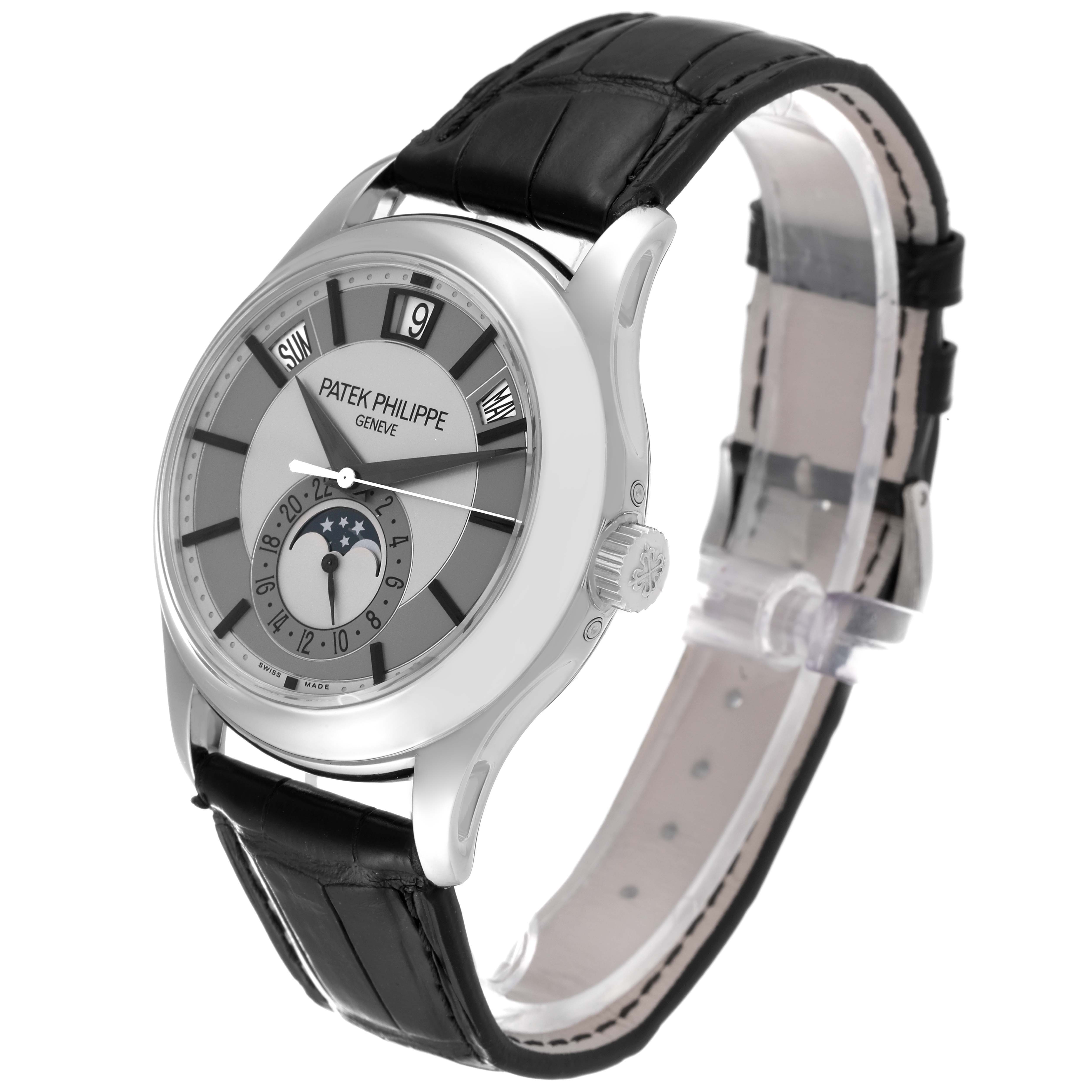 The Patek Philippe Complications 5205G-001 Men's White Gold Silver Dial 5205G-001 Men's White Gold Silver Dial model is shown at a slight angle, highlighting the dial, case, crown, and black leather strap.