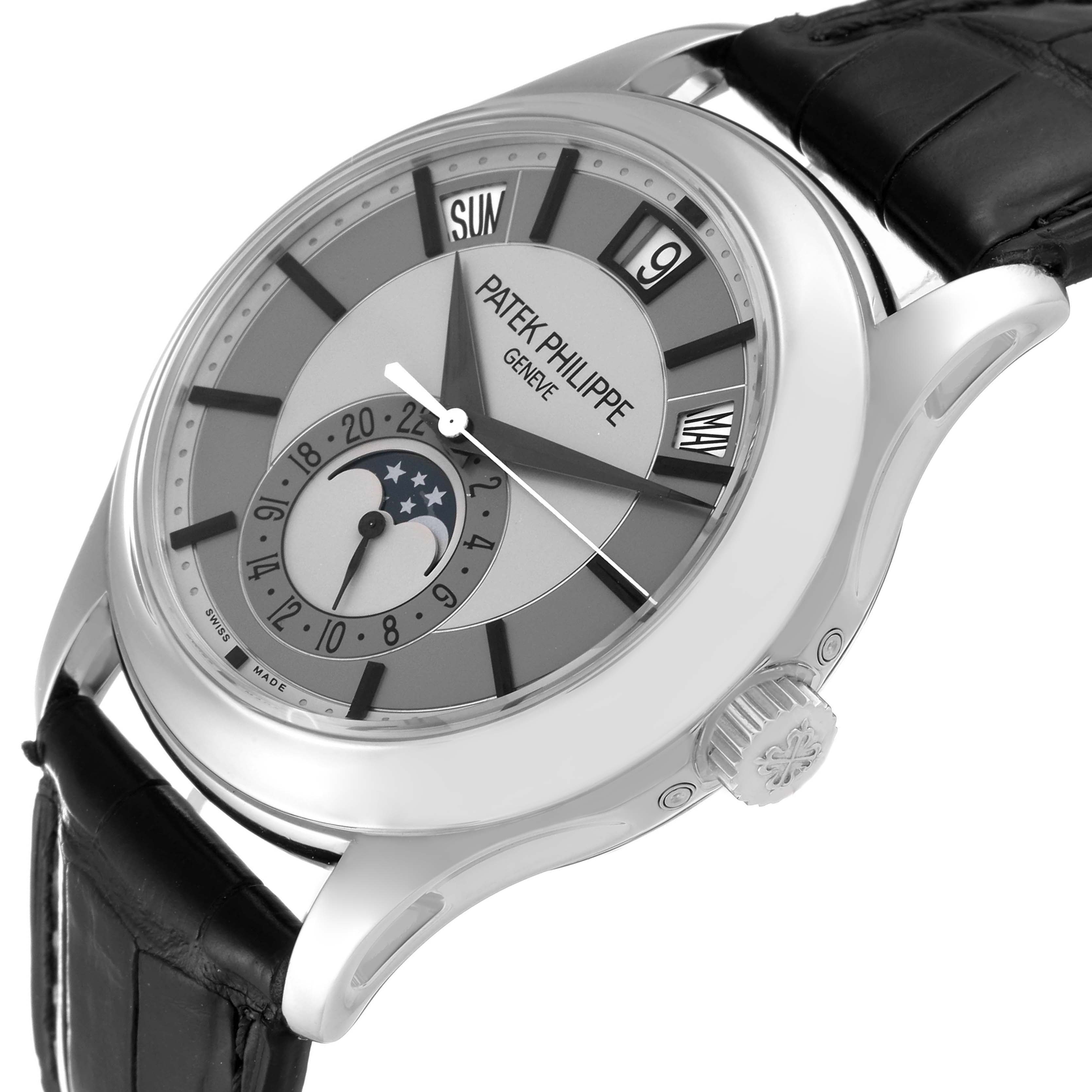 The image shows a side view of the Patek Philippe Complications 5205G-001 Men's White Gold Silver Dial 5205G-001 Men's White Gold Silver Dial watch, displaying its dial, moon phase indicator, crown, and leather strap.